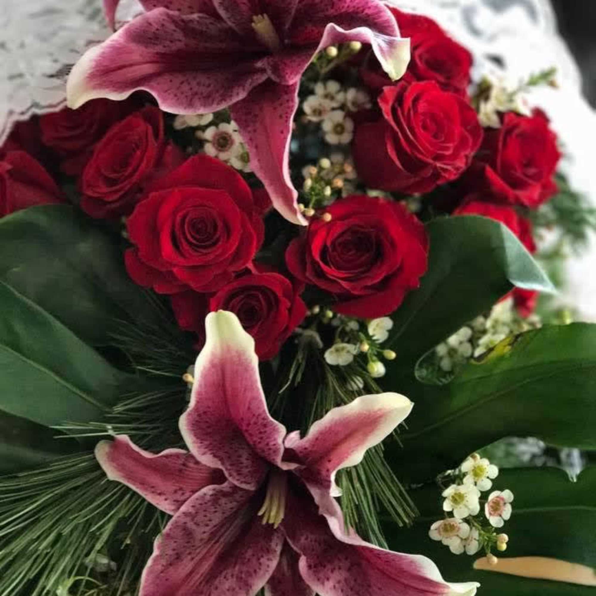 Red Rose and Lily Cascade Bouquet  will bring passion in style.


In