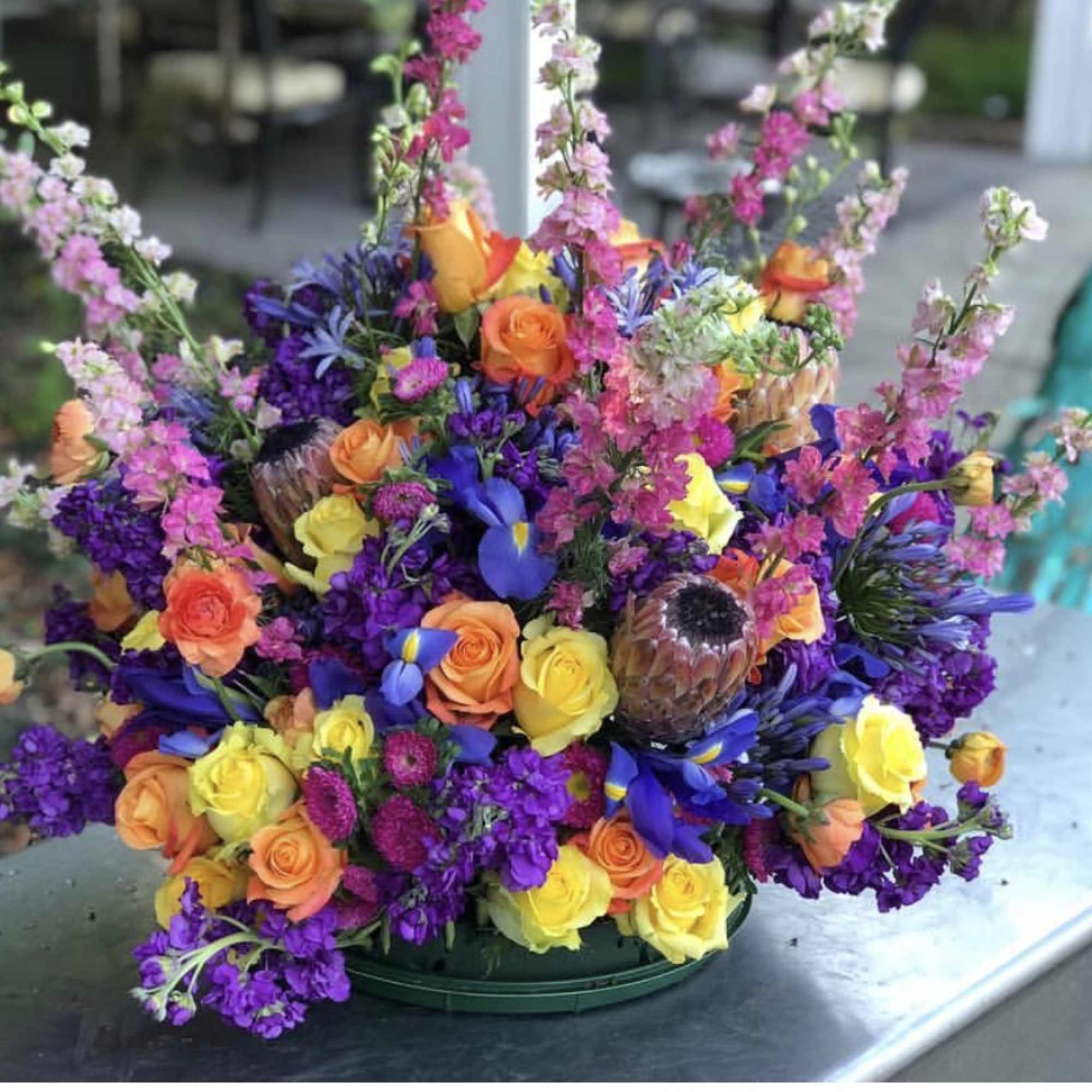 This vivid and eye-catching arrangement is built to be the center of