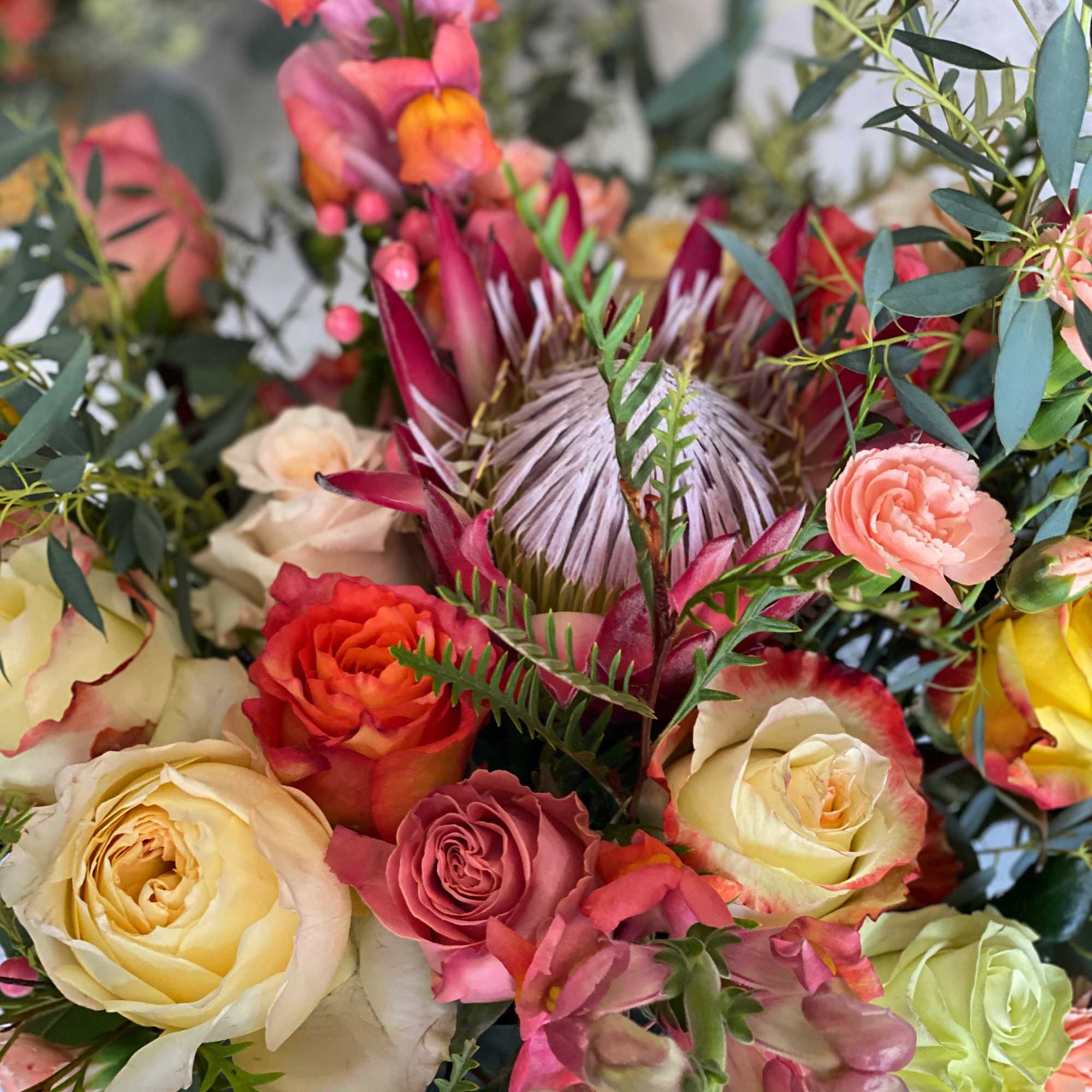 This stunning arrangement boasts all the colors and tones of the Italian
