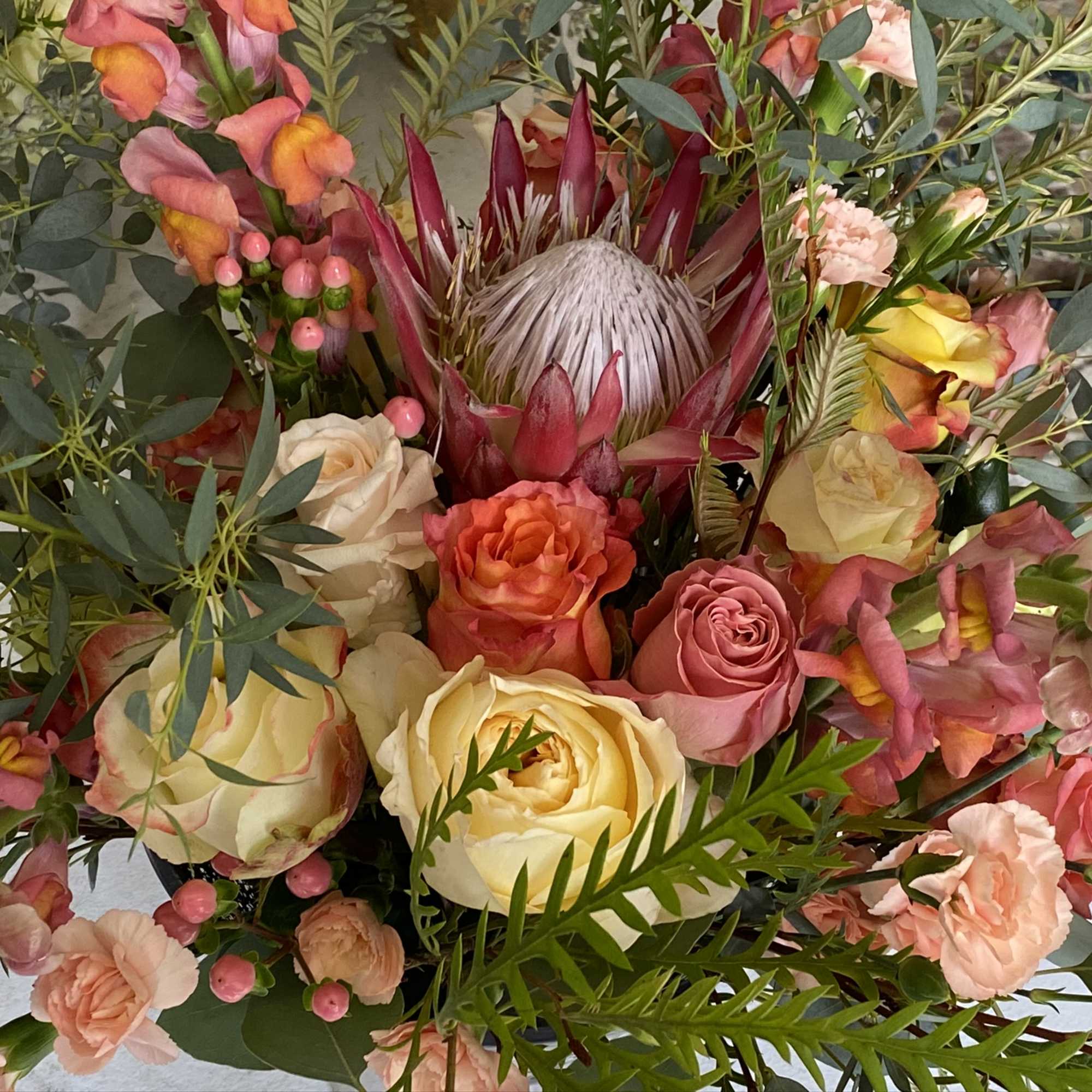 This stunning arrangement boasts all the colors and tones of the Italian