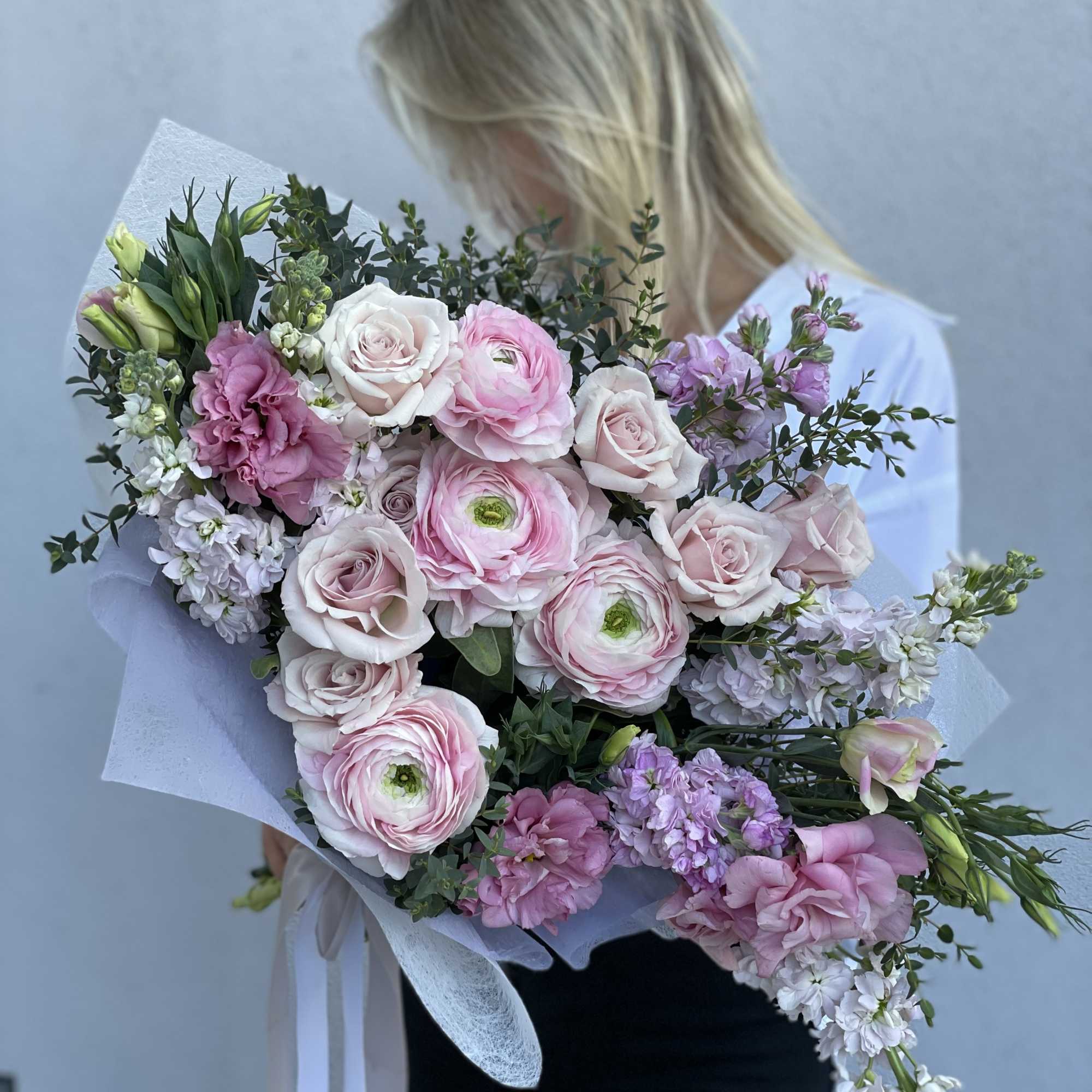 The most delicate ranunculus and roses with airy lisianthus, a very delicate
