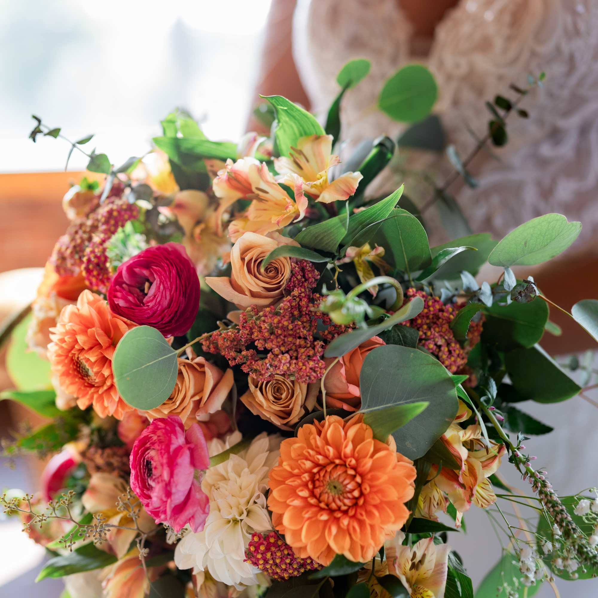 Beautiful fall colors mixed Vintage/ boho cascade with Dahlias, ranunculus's, roses and