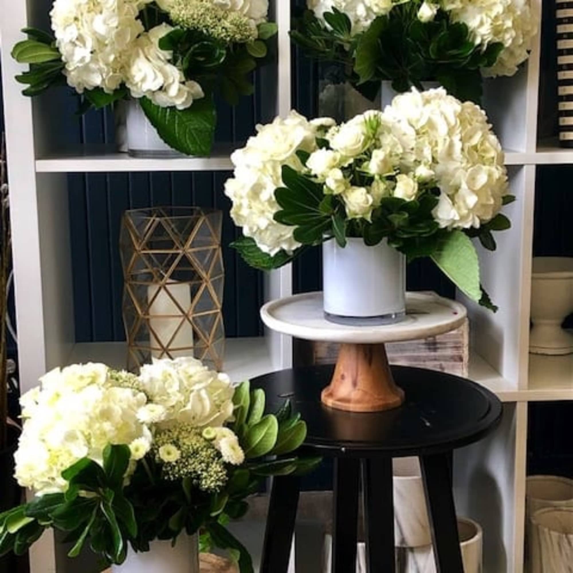Modern Round Glass consisting of White Hydrangea, Pit, White Spray Roses, And