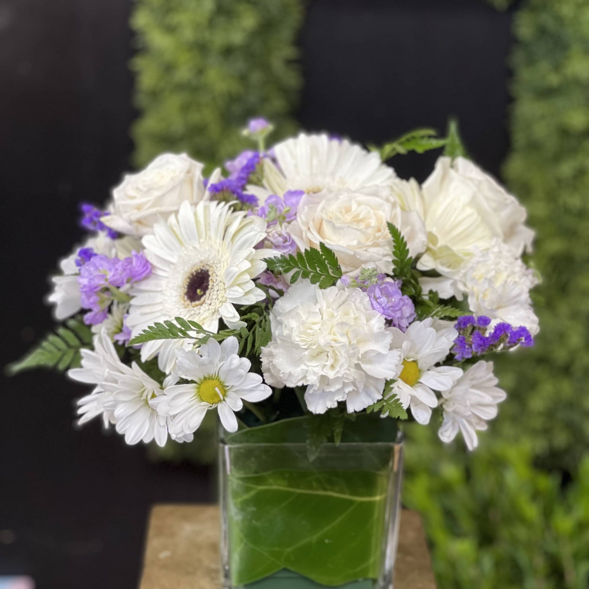 Mixture of white and blue flowers ( can be purple filler) in