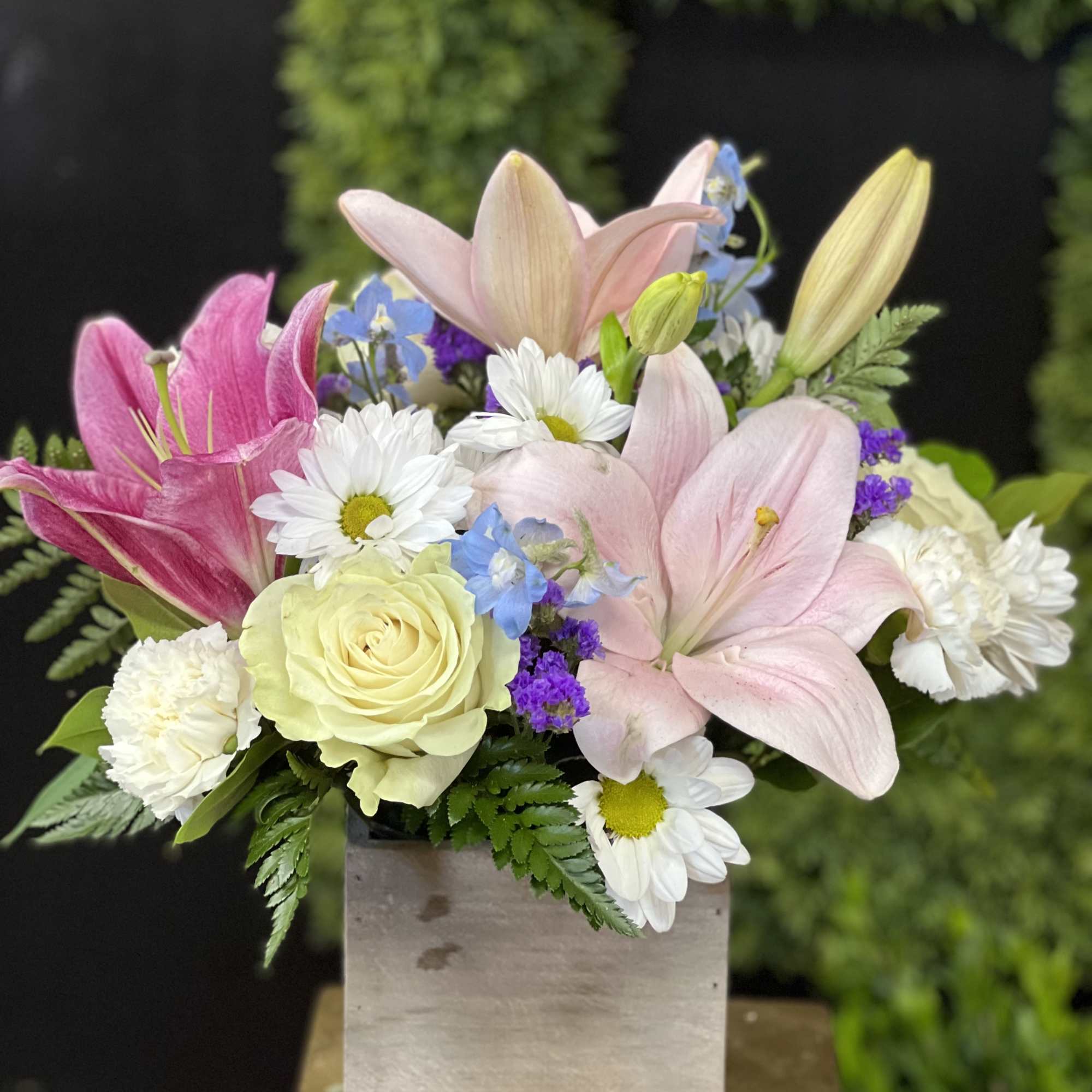 Mixture of white and blue flowers ( can be purple filler) in