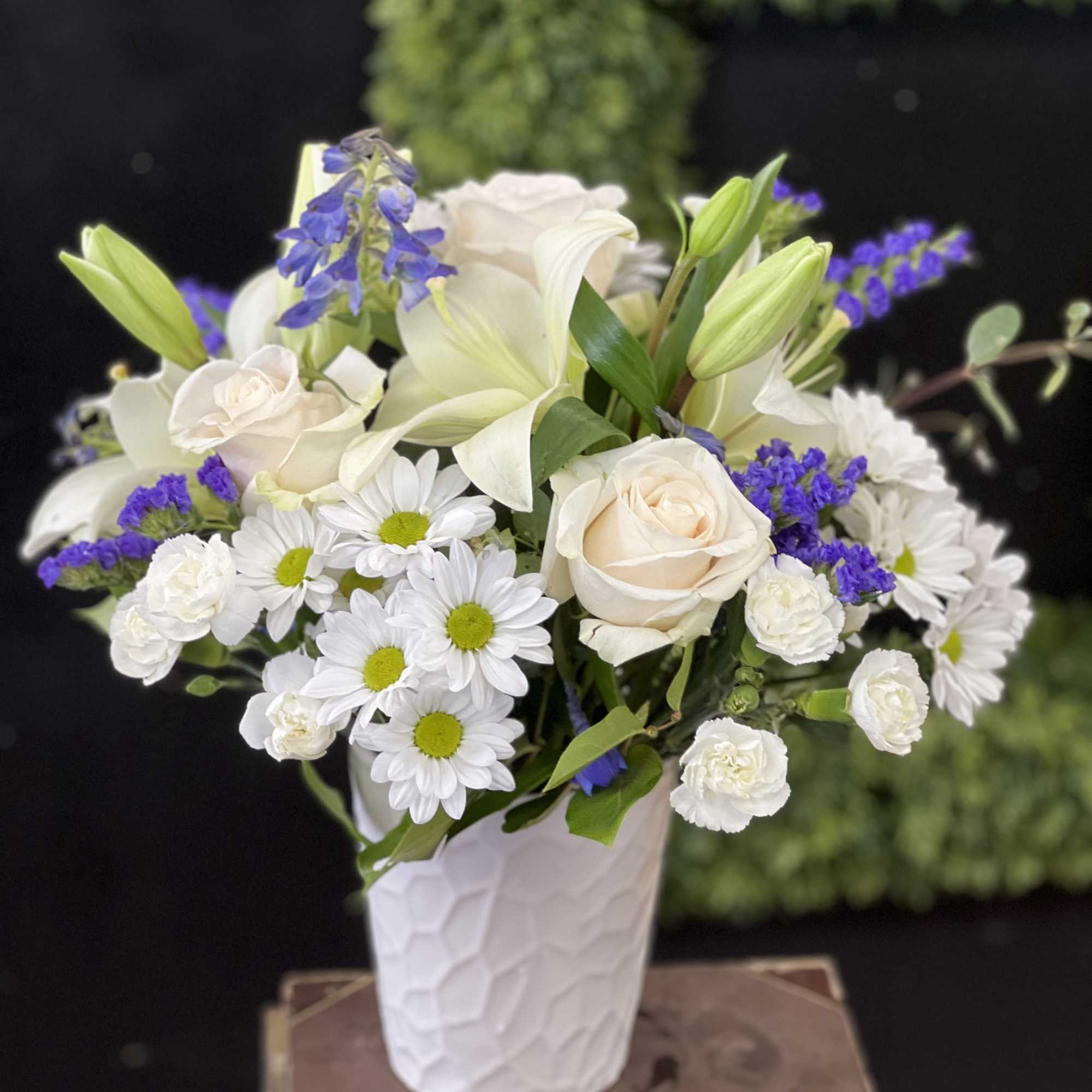 Mixture of white and blue flowers ( can be purple filler) in