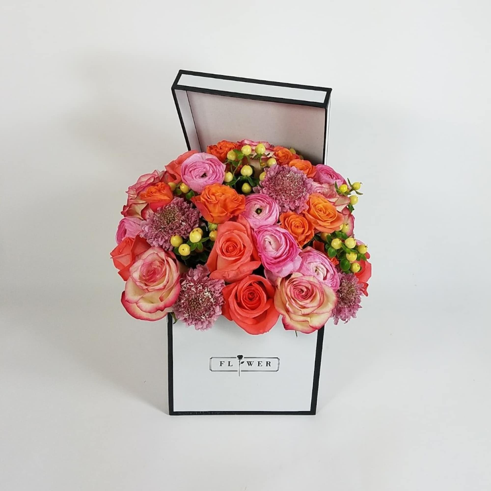 A box full of 16 Premium roses, 8 ranunculus, and greenery  A box full of 16 Premium roses, 8 ranunculus, and greenery