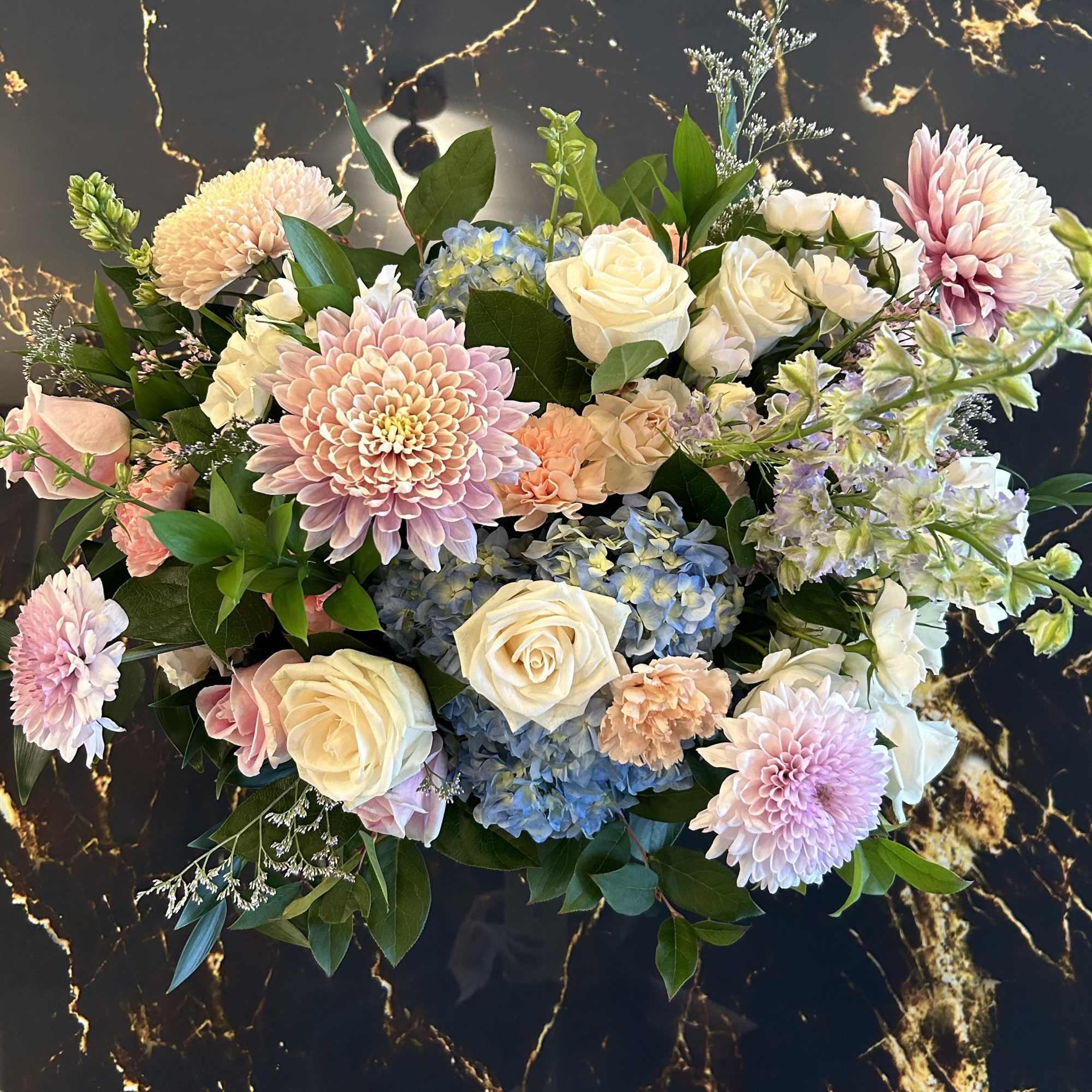 Embrace a bursts of pastel colors in this large Garden Sunshine arrangement.