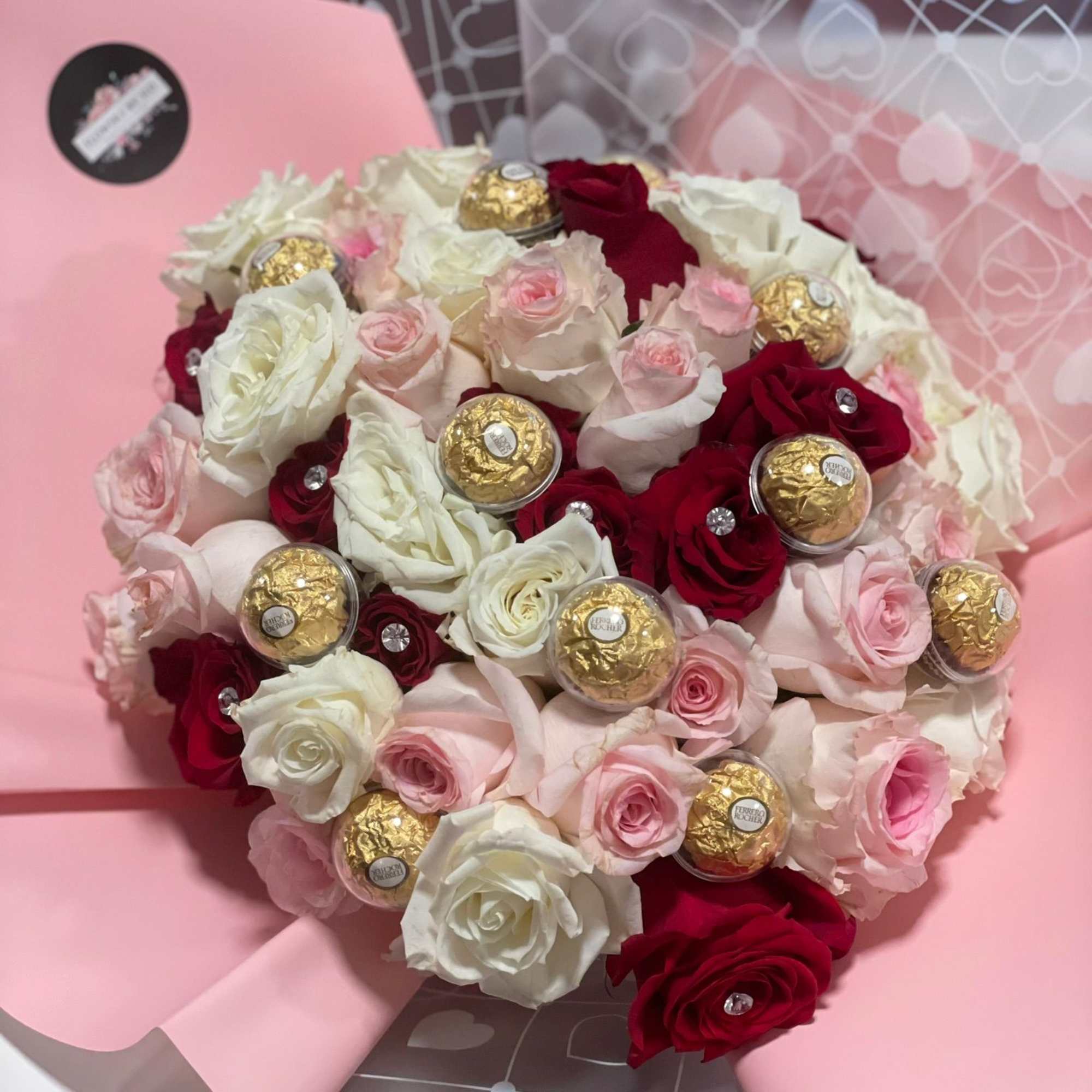 Very popular Buchon bouquet with red and pink, and white roses, Ferrero