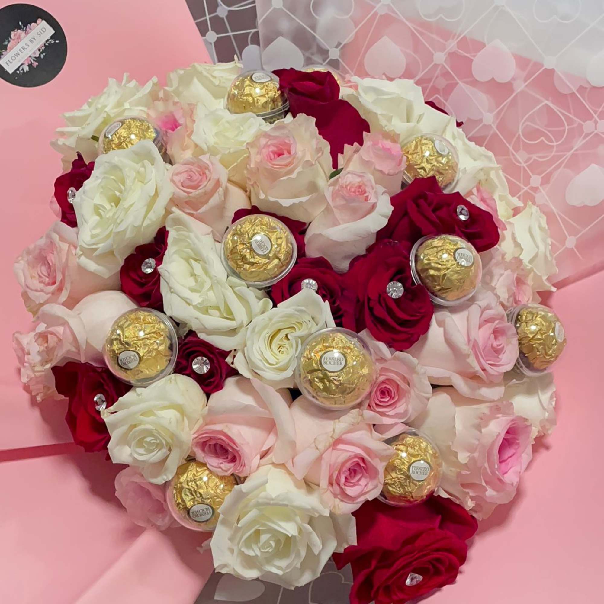 Very popular Buchon bouquet with red and pink, and white roses, Ferrero