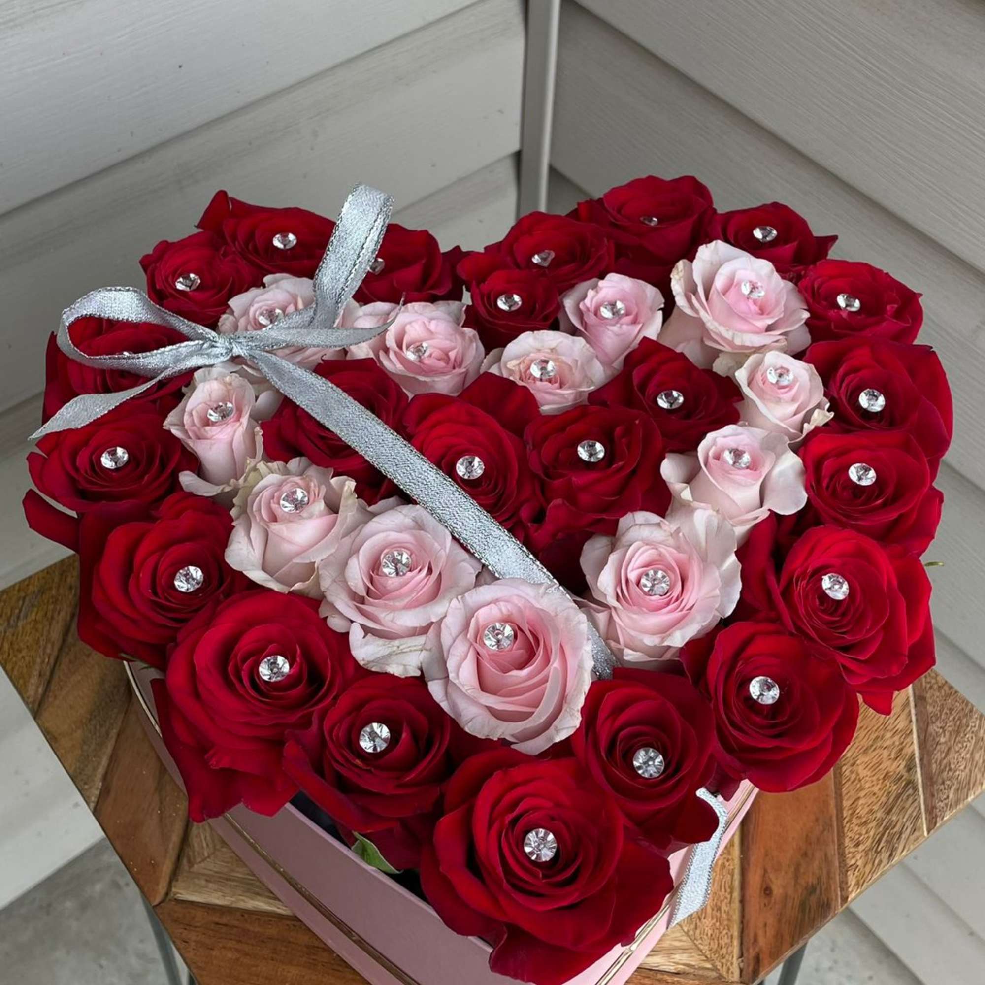 Romantic roses in a heart shaped velvet box. 