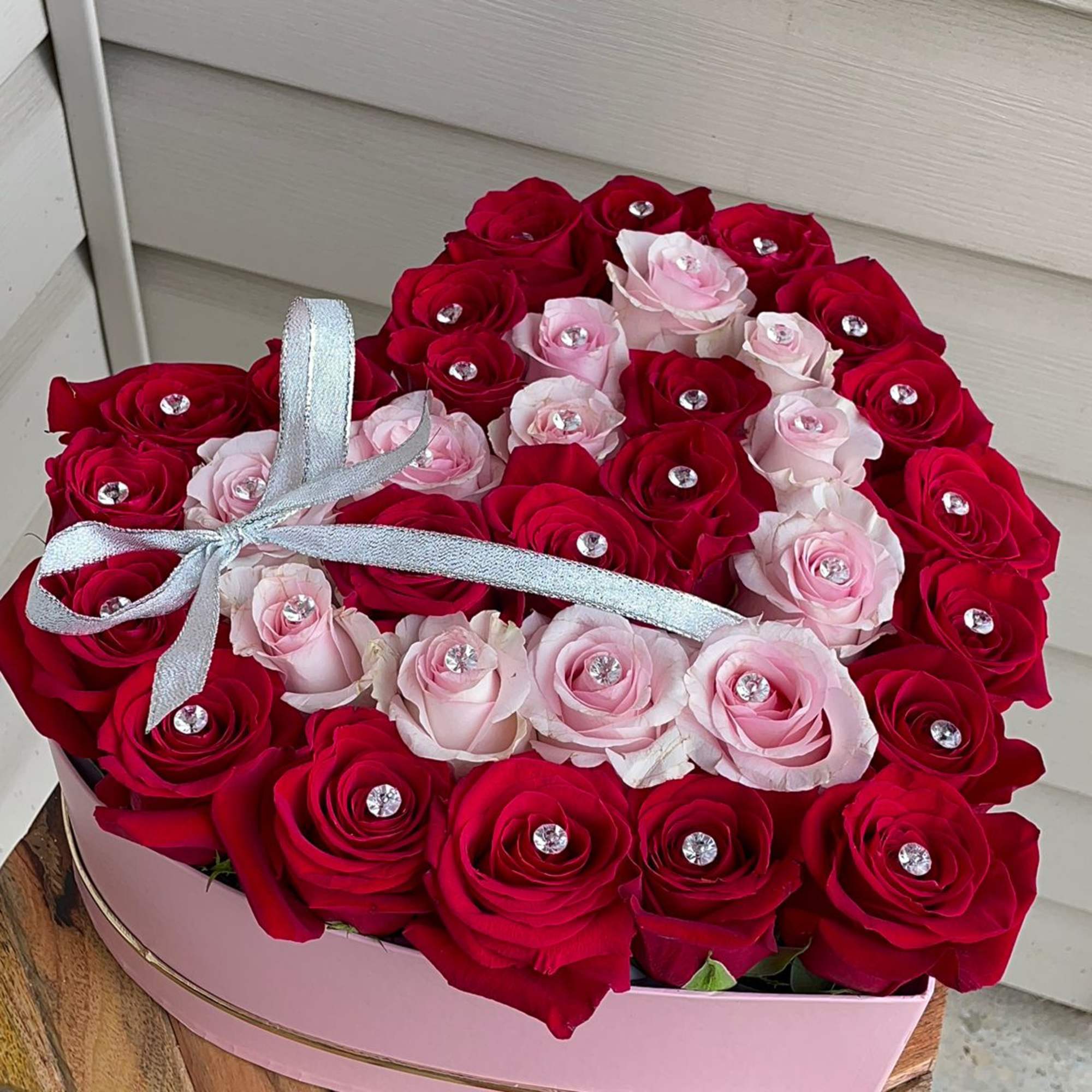 Romantic roses in a heart shaped velvet box. 