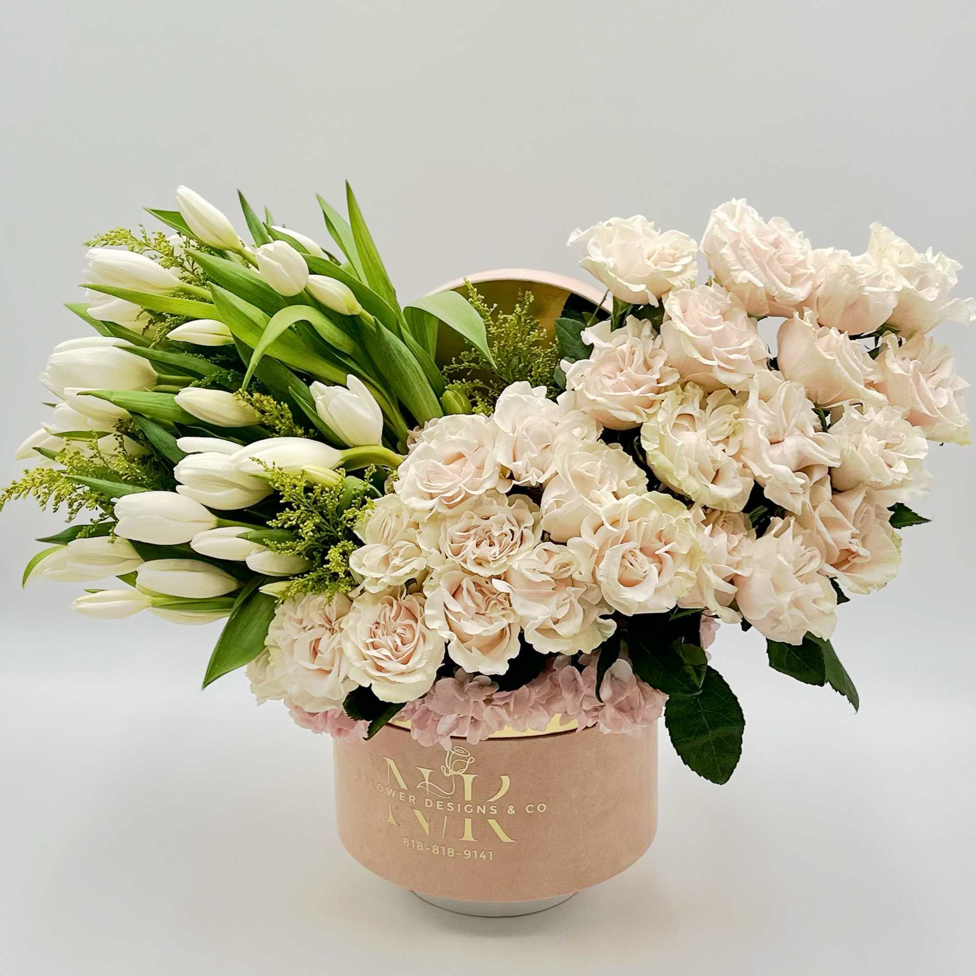 Two beauties in one box. This arrangement with tulips on one side