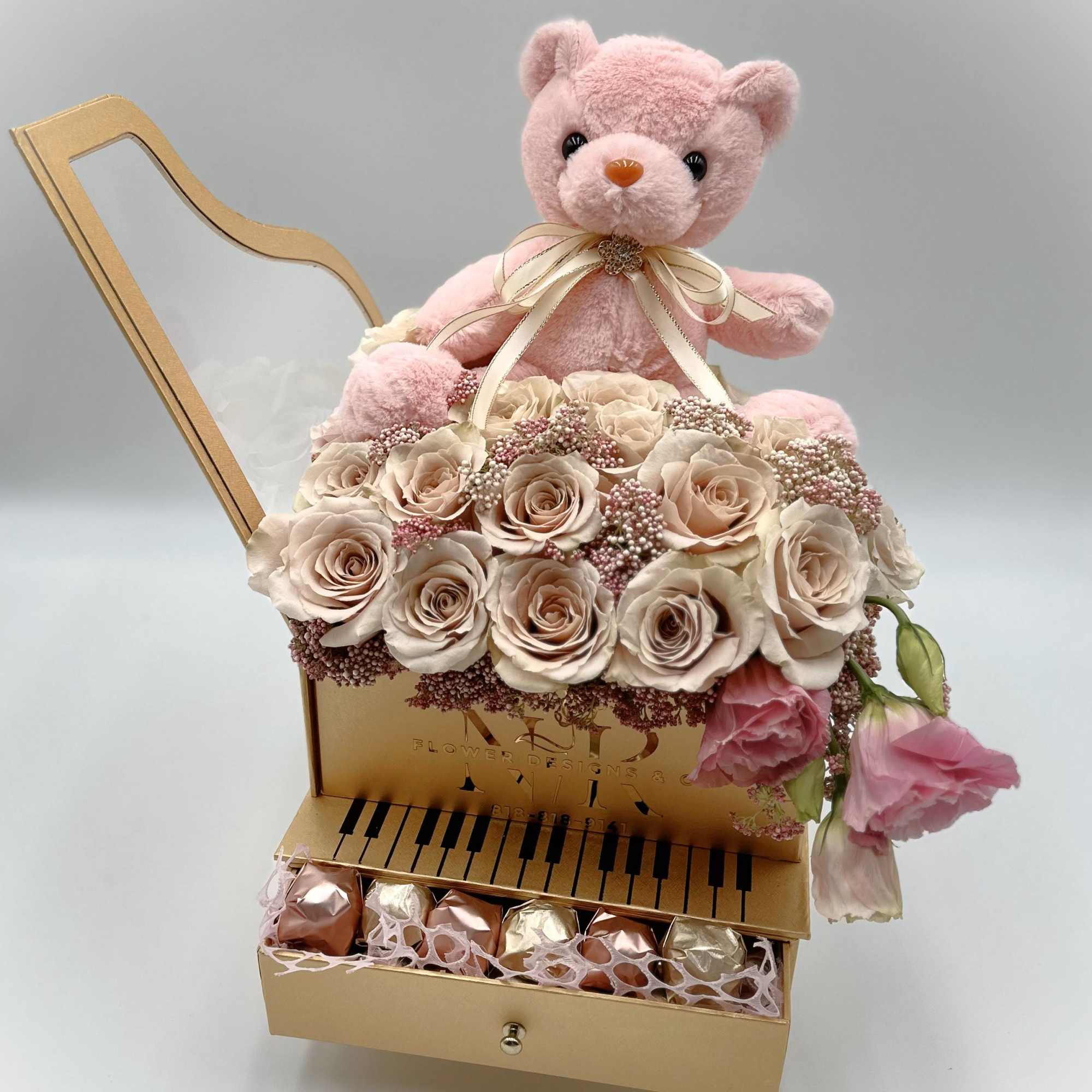 Tasteful way to welcome a baby girl! Soft pink roses with a