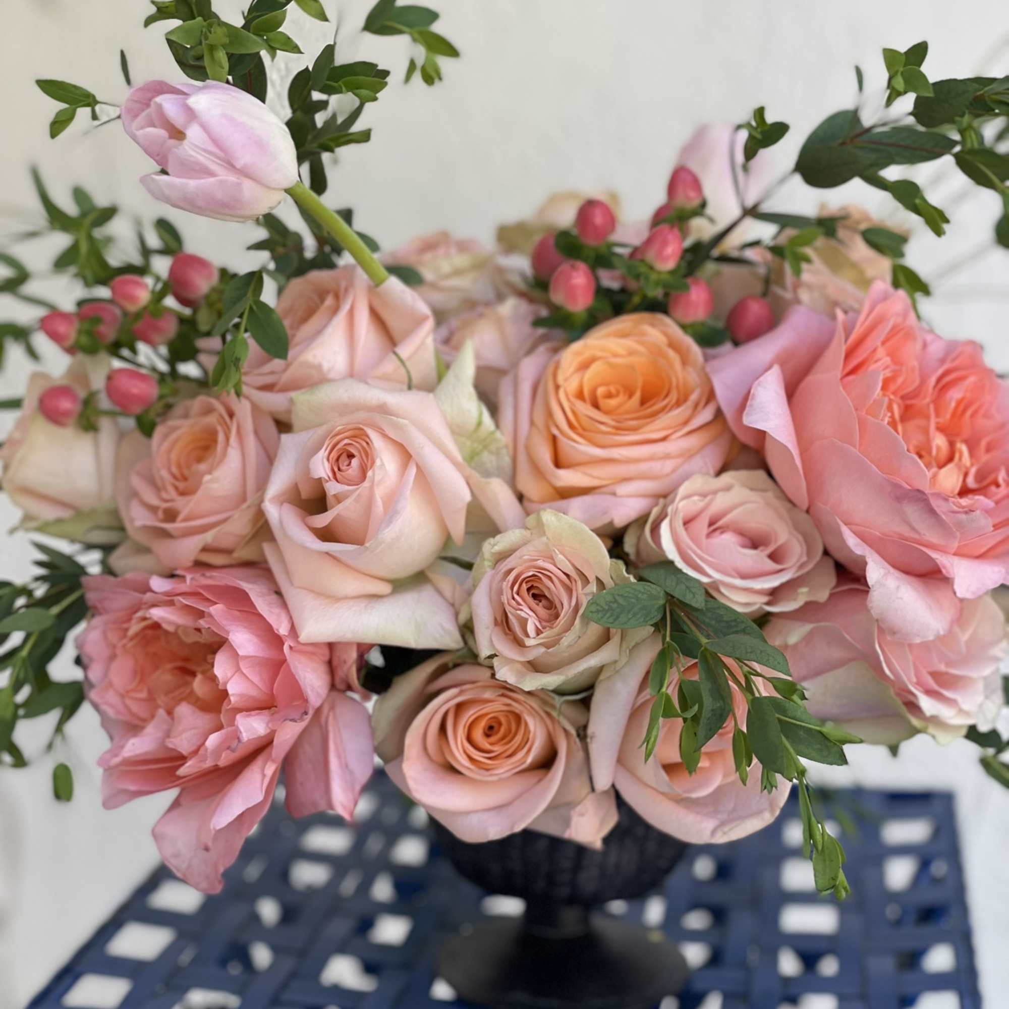 This little arrangement packs a big punch, with its brightly colored roses