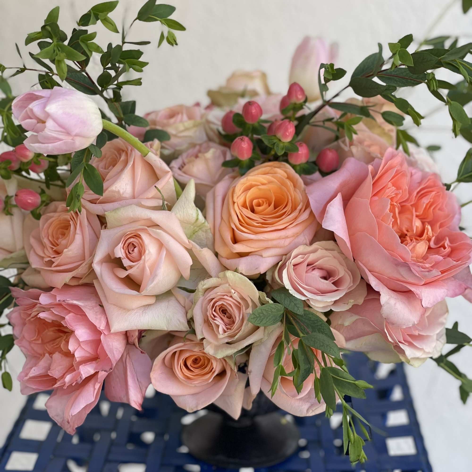 This little arrangement packs a big punch, with its brightly colored roses