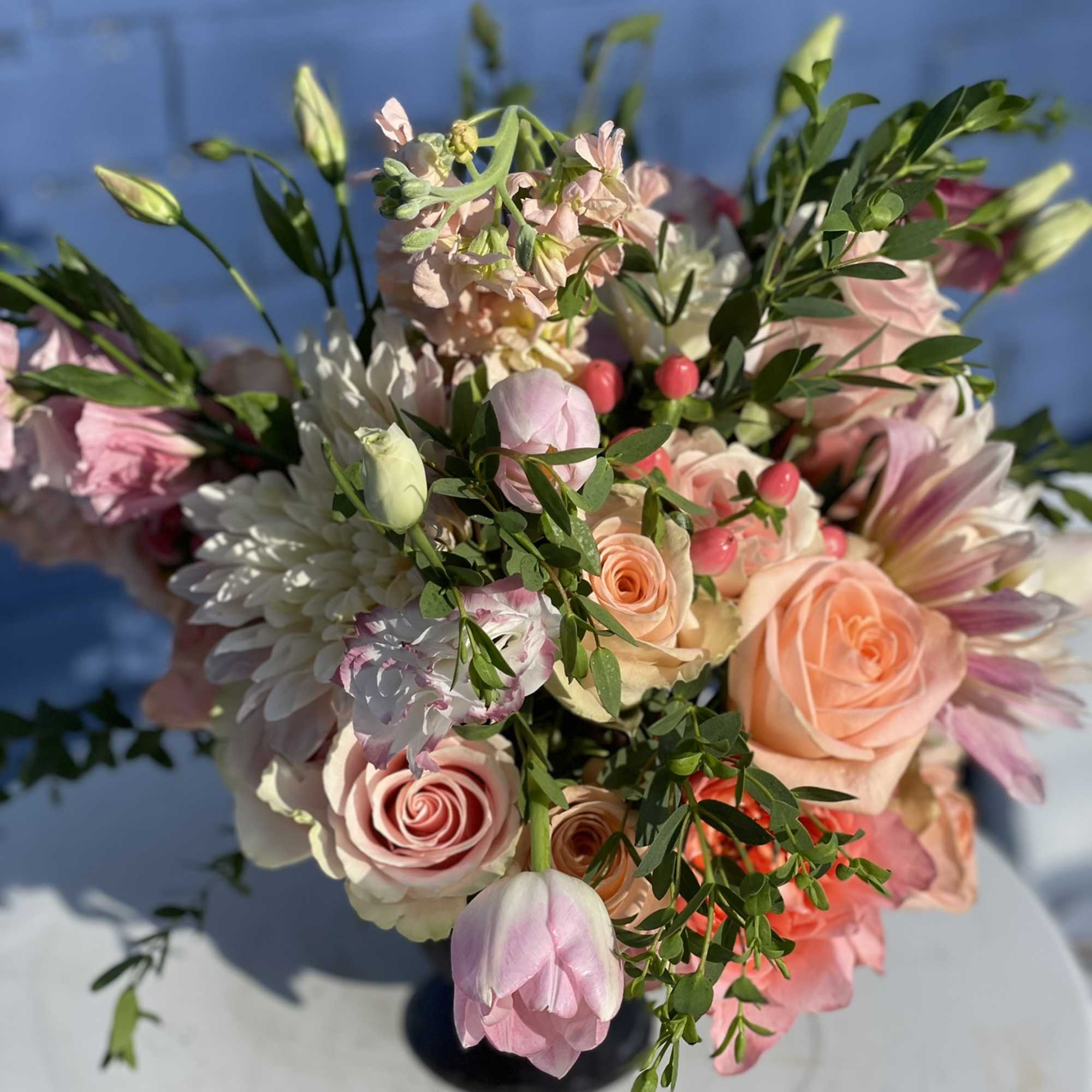 This little arrangement packs a big punch, with its brightly colored roses