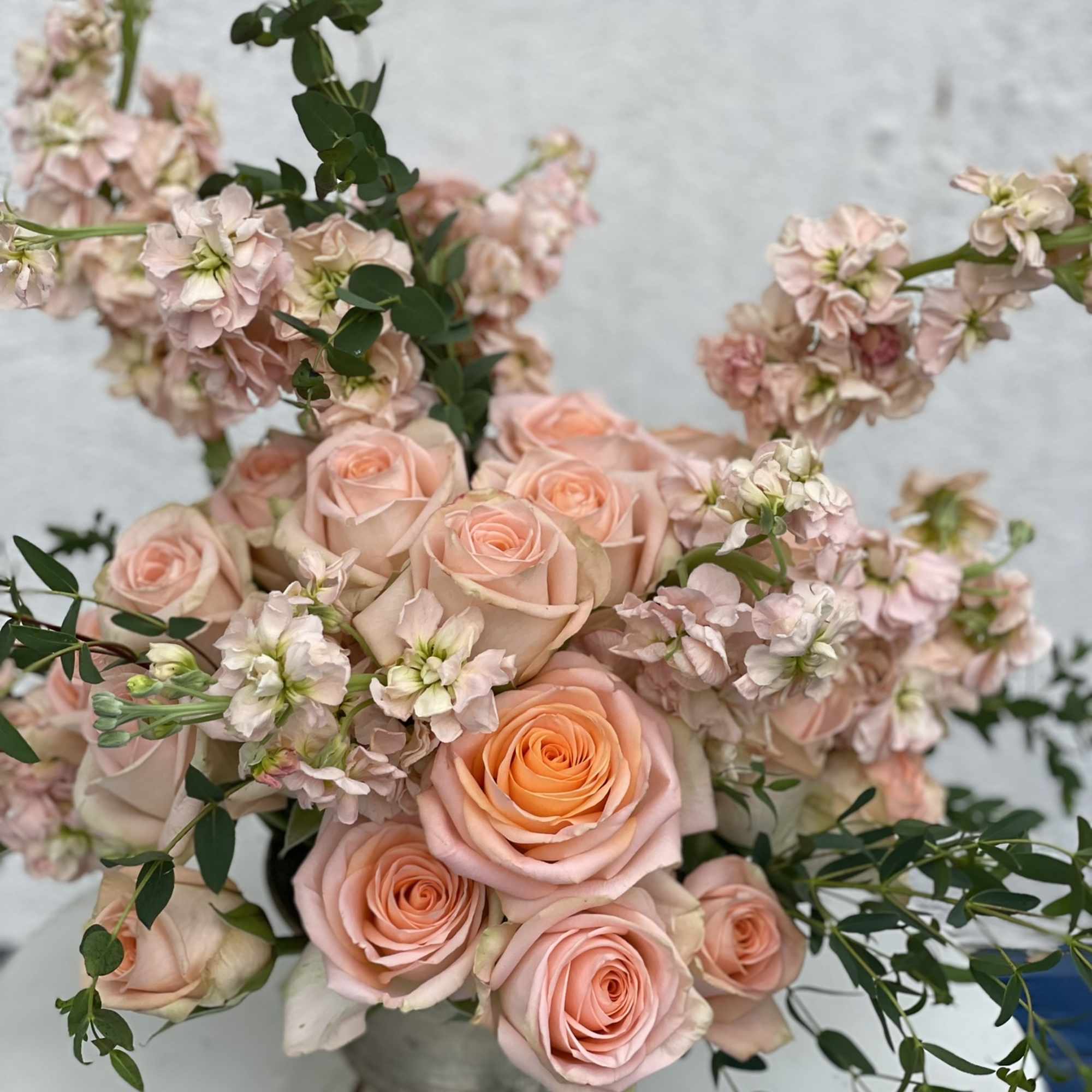 This beatiful arrangement is packed full of peach blooms, making a joyful