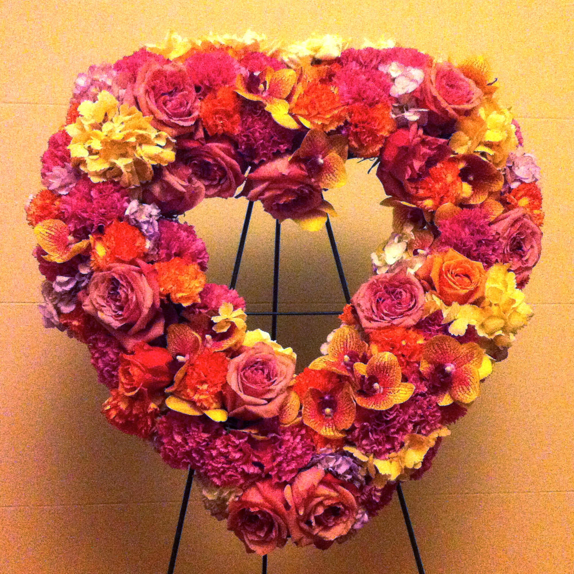 A mix of beautiful fresh blooms in a shape of a heart. A mix of beautiful fresh blooms in a shape of a heart.