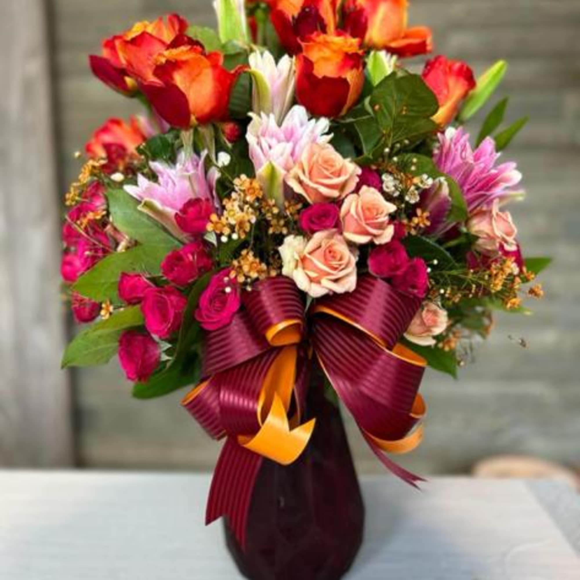 This vibrant floral arrangement is a celebration of love and passion 