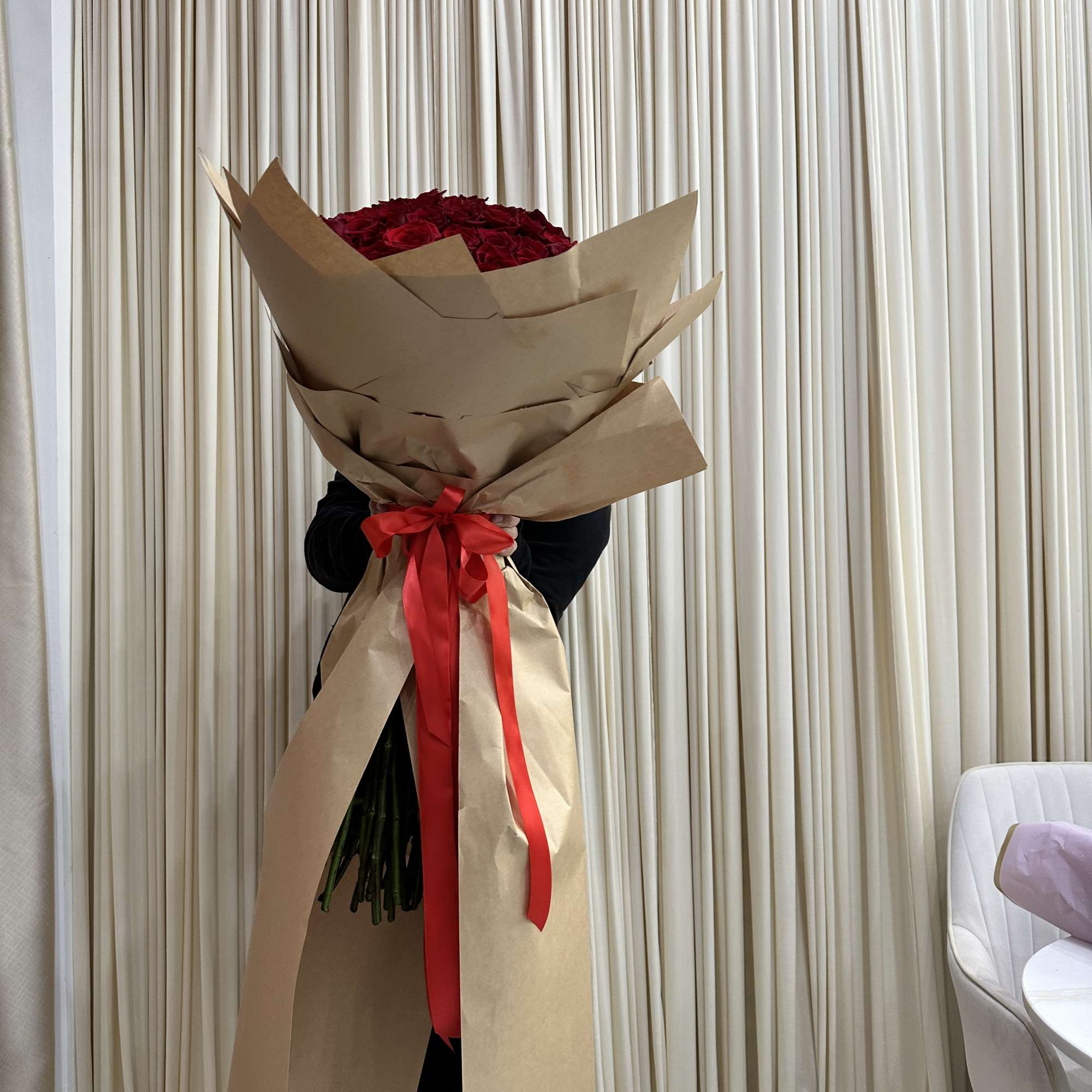 Wrapped in a cascading dress style, this dramatic bouquet of 150 