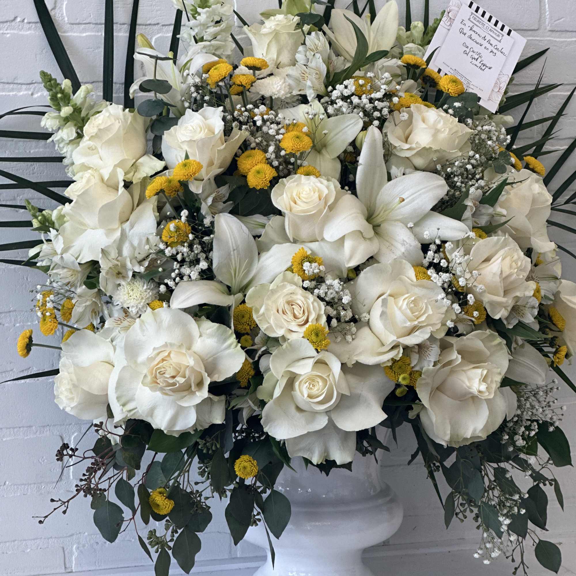 Introducing our "Radiant Sunlight Stand," a striking arrangement featuring white and yellow Introducing our "Radiant Sunlight Stand," a striking arrangement featuring white and yellow