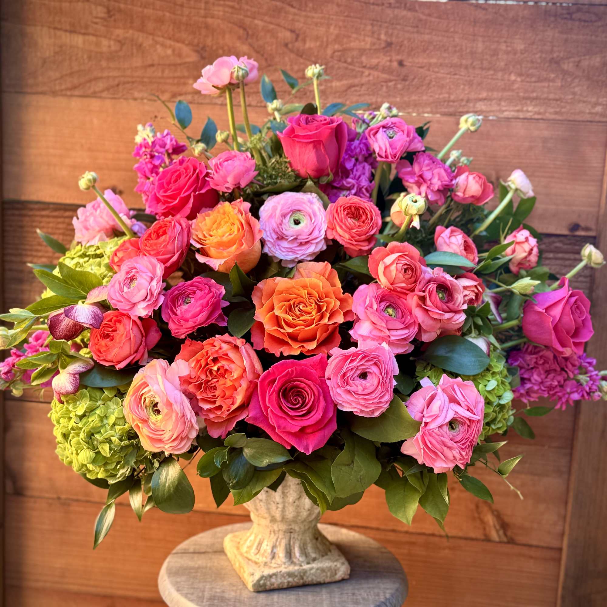 Starting with an elegant concrete pedestal vase, gorgeous spray roses, Kahala roses
