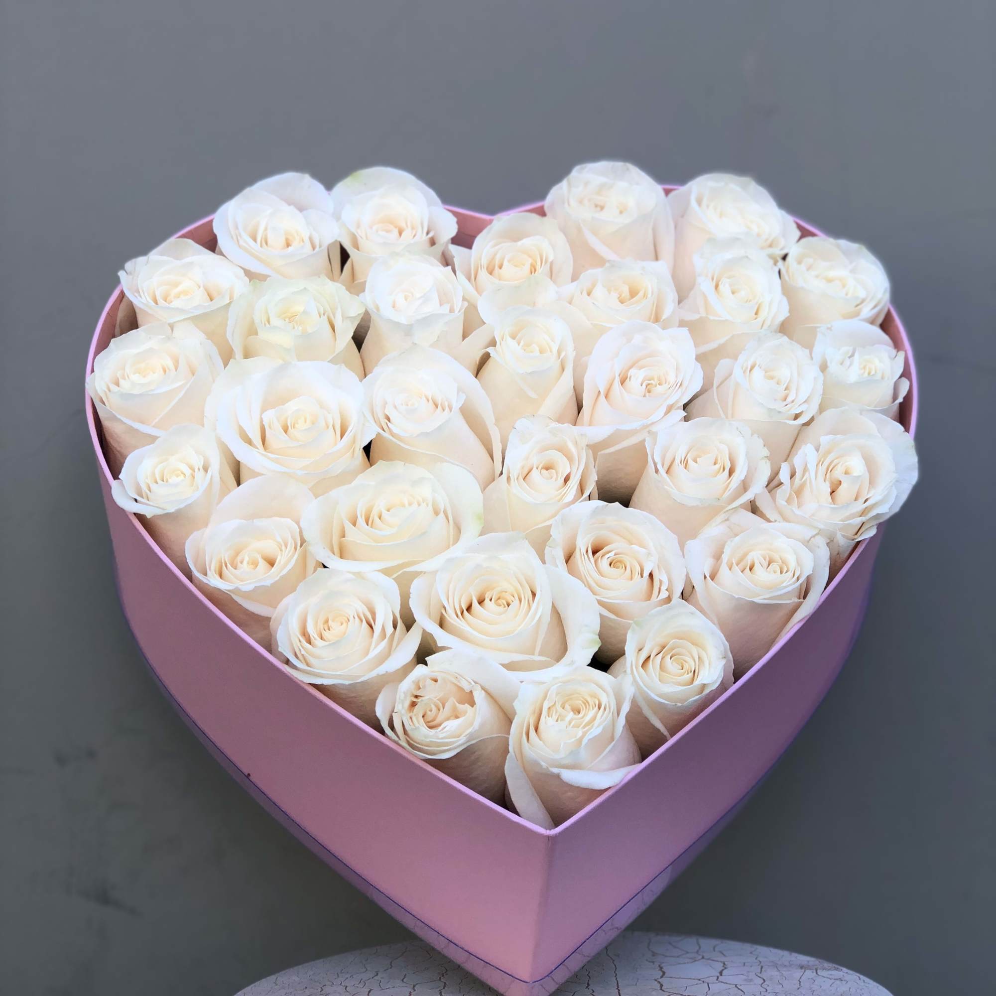 Heart box with fresh white roses. 