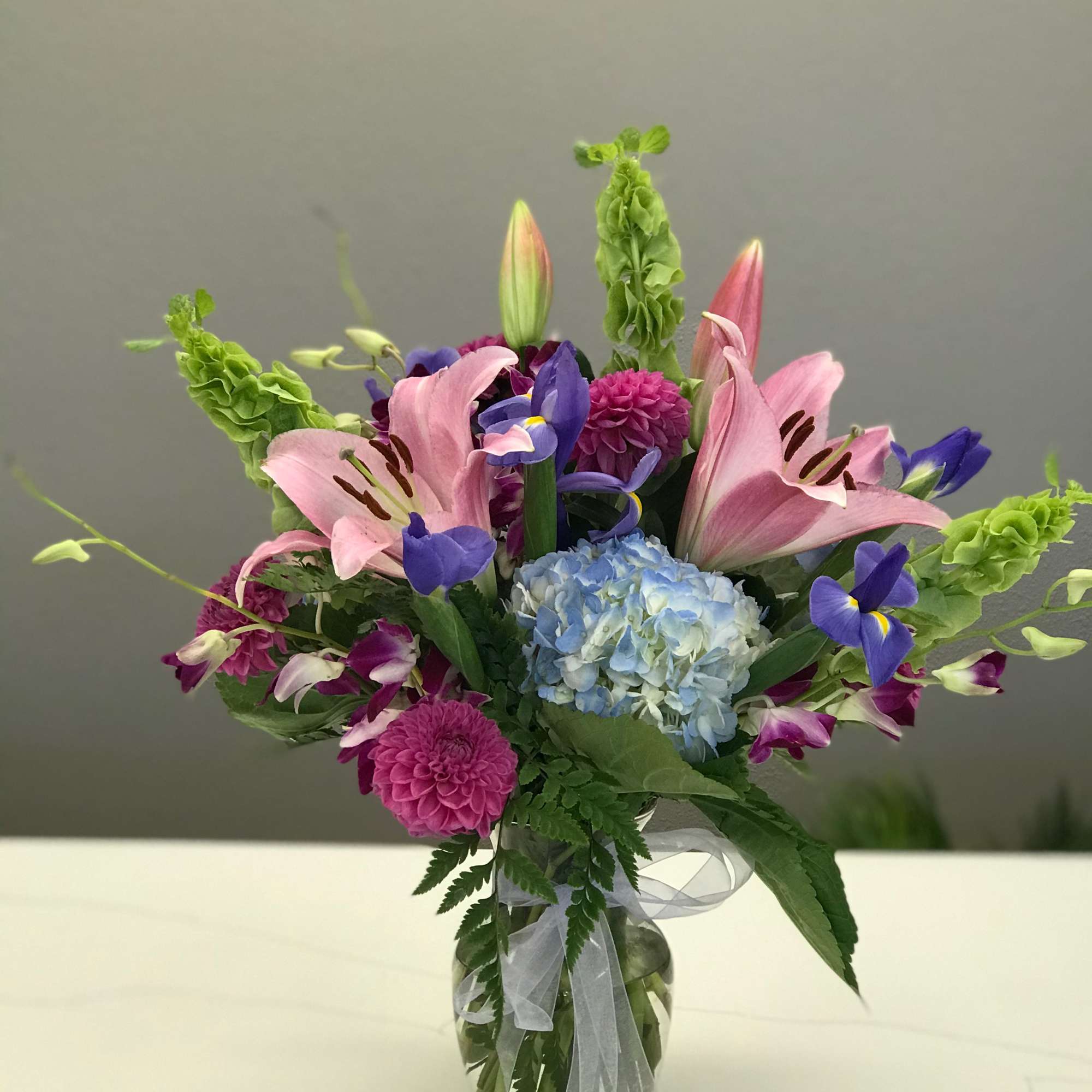 The beaut is dripping in jewel toned blooms ready to bring a