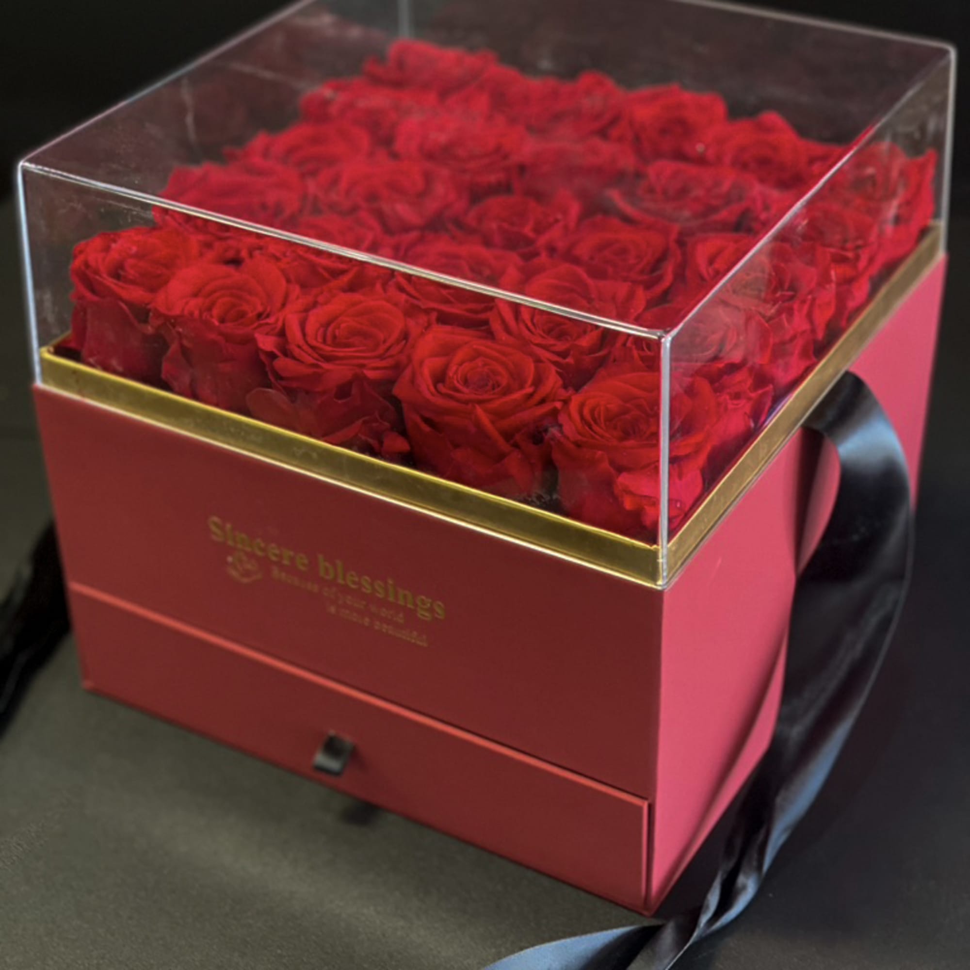 Red Forever Roses in acrylic box 
This elegant arrangement of Preserved Luxury