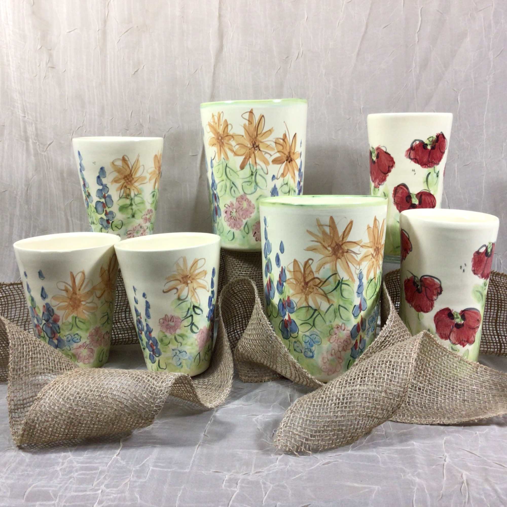 An Impressionist Garden Arrangement fill this limited edition commissioned container. This handsome