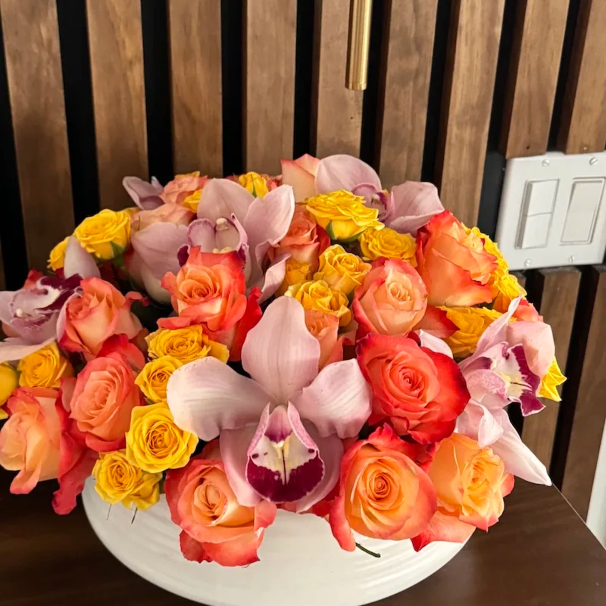  Colorful  orange roses and cymbidium orchids. Perfect gift for Mother