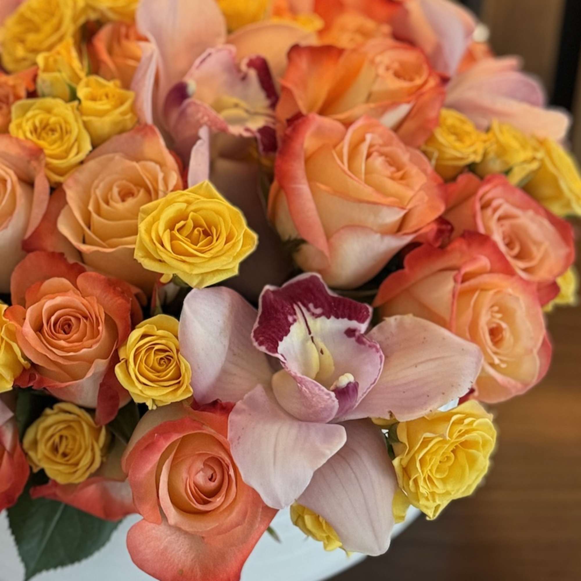  Colorful  orange roses and cymbidium orchids. Perfect gift for Mother