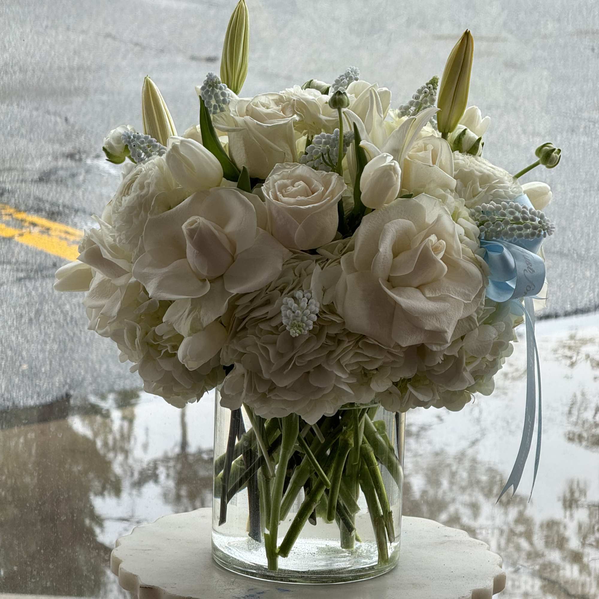 mix of white flowers with a touch of baby blue 