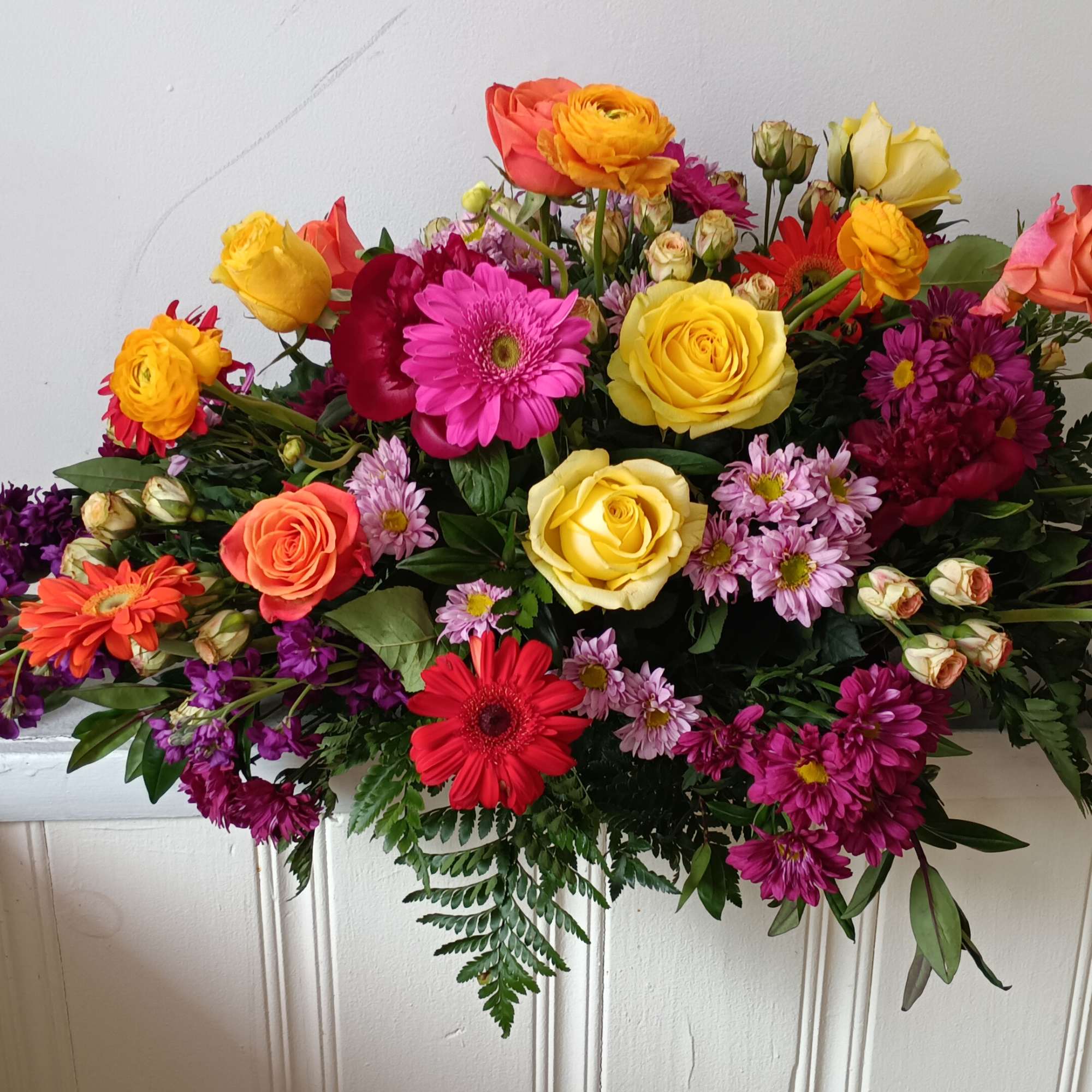 Casket sat: 1) half a casket spray, 2) half a casket spray