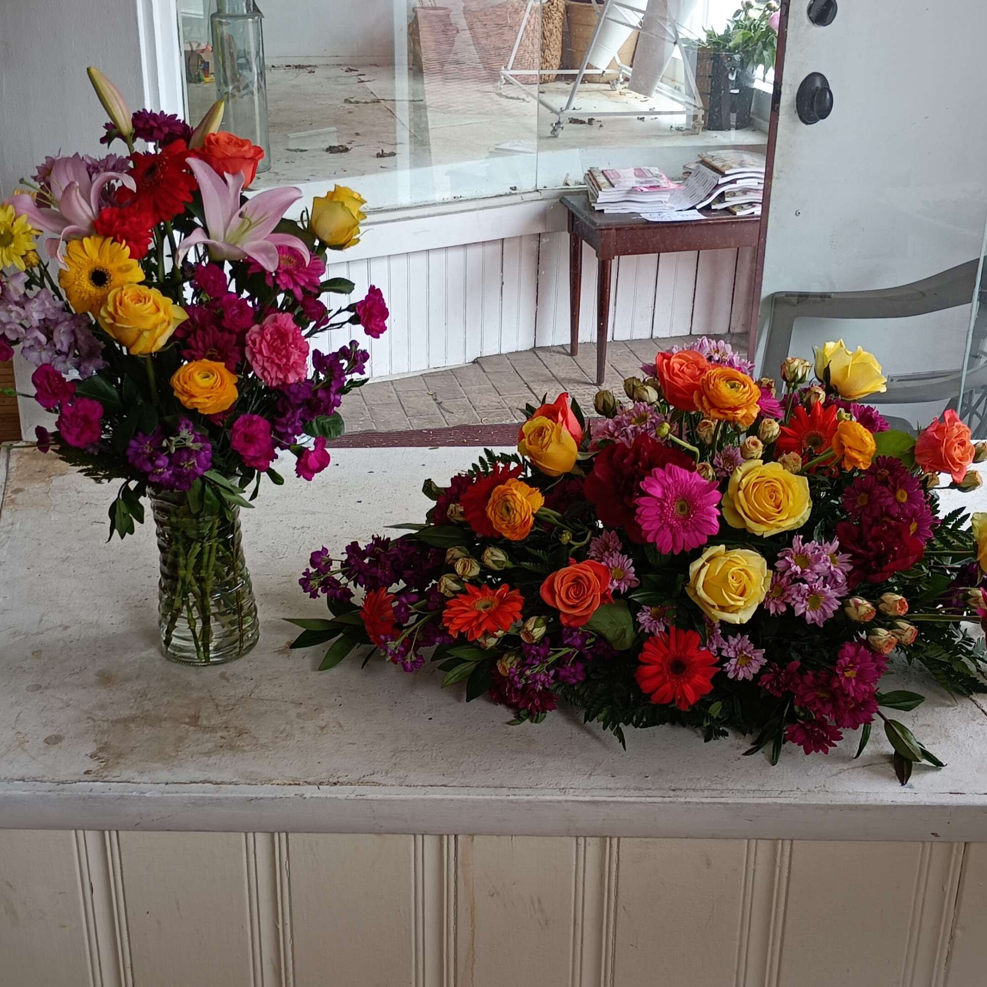 Casket sat: 1) half a casket spray, 2) half a casket spray