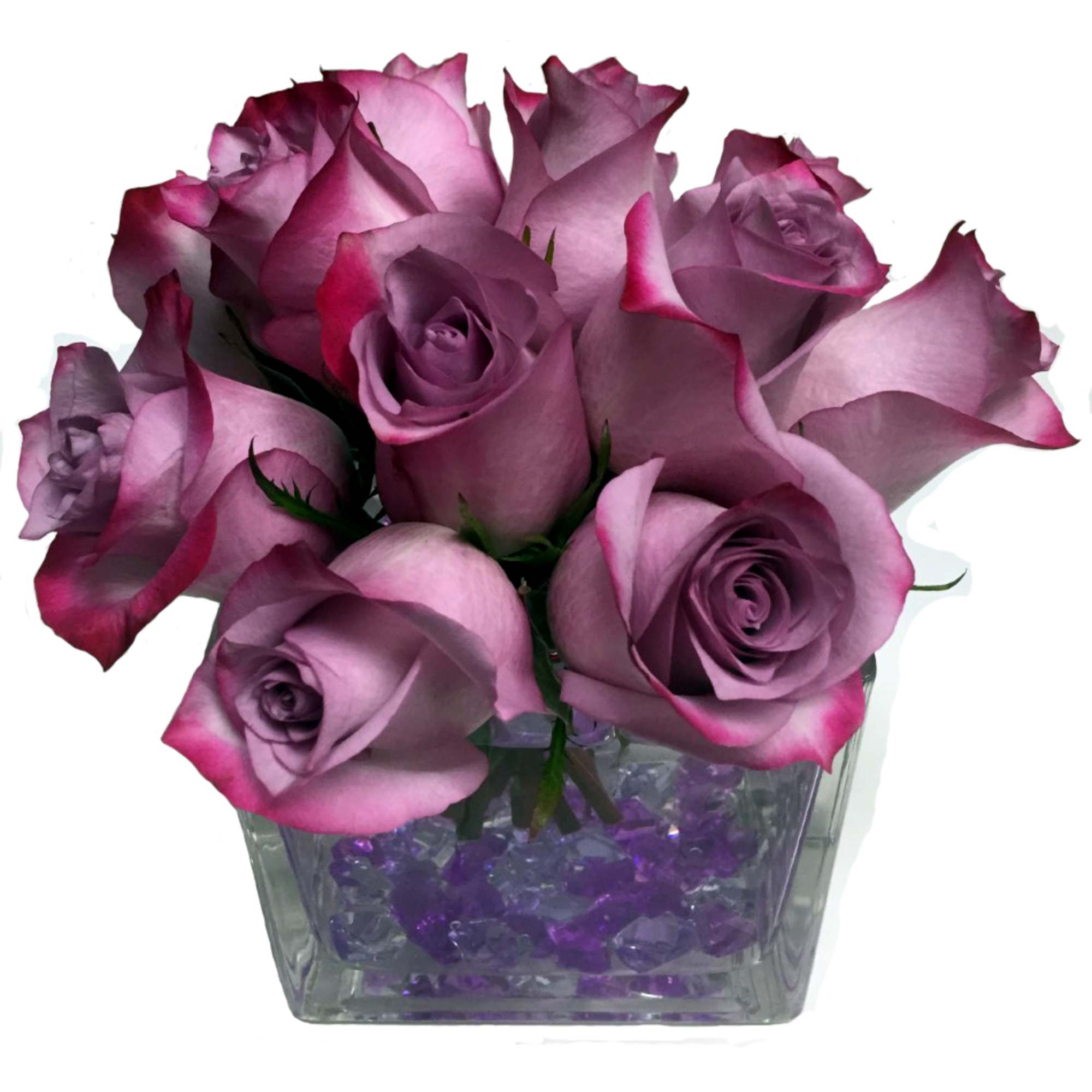 An enchanting bouquet of lavender roses sweetly touches her heart. Accented with