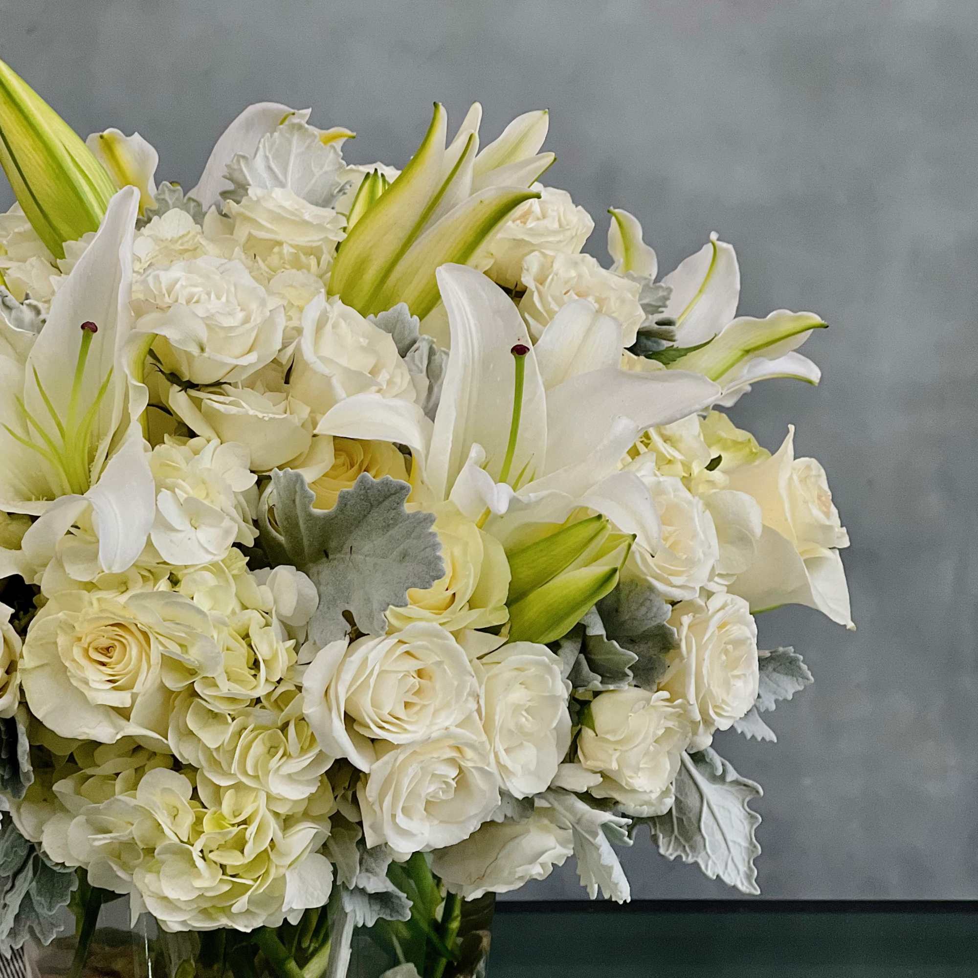 This dreamy white floral mix is heavenly. The cylinder glass vase holds