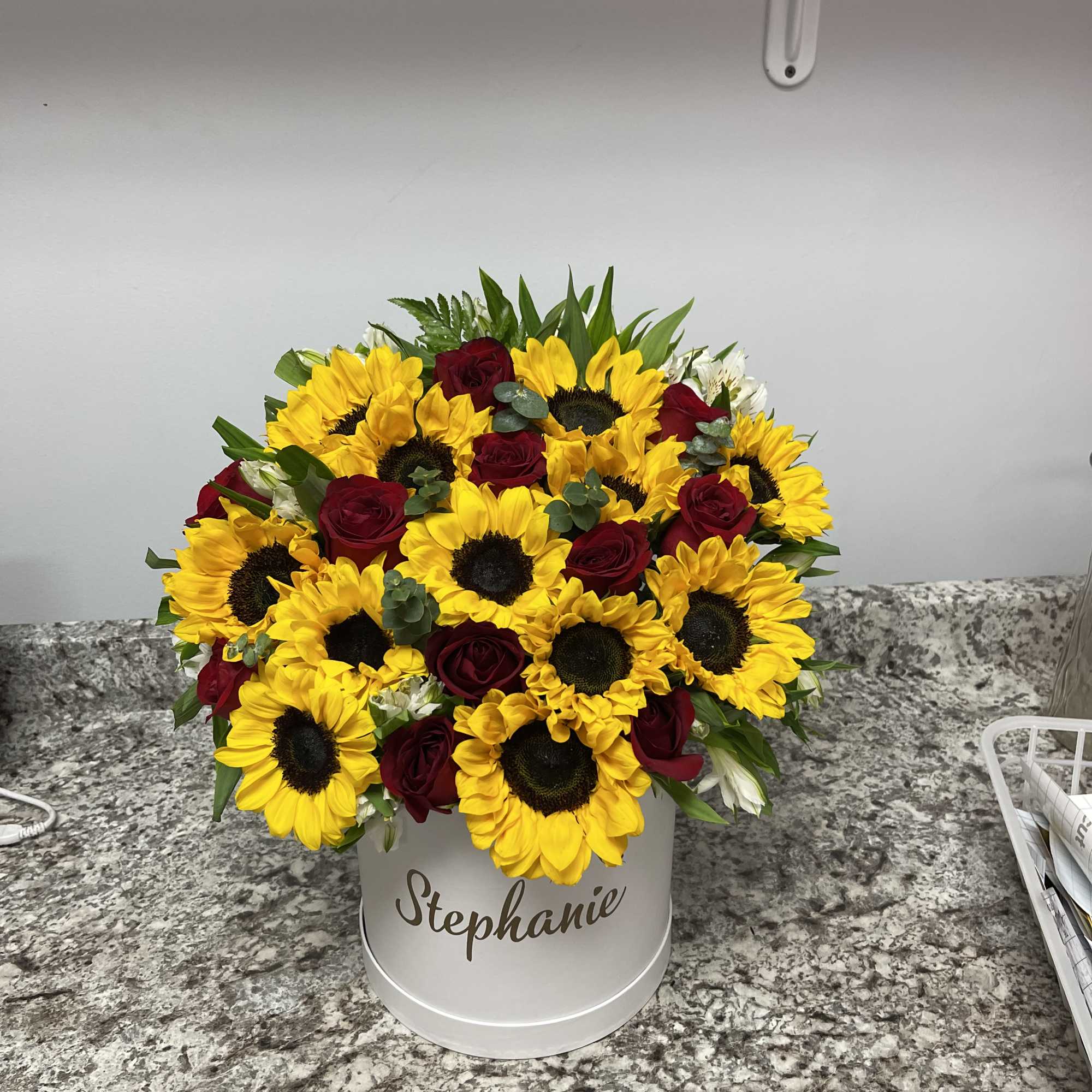a mix sunflowers and red rose 