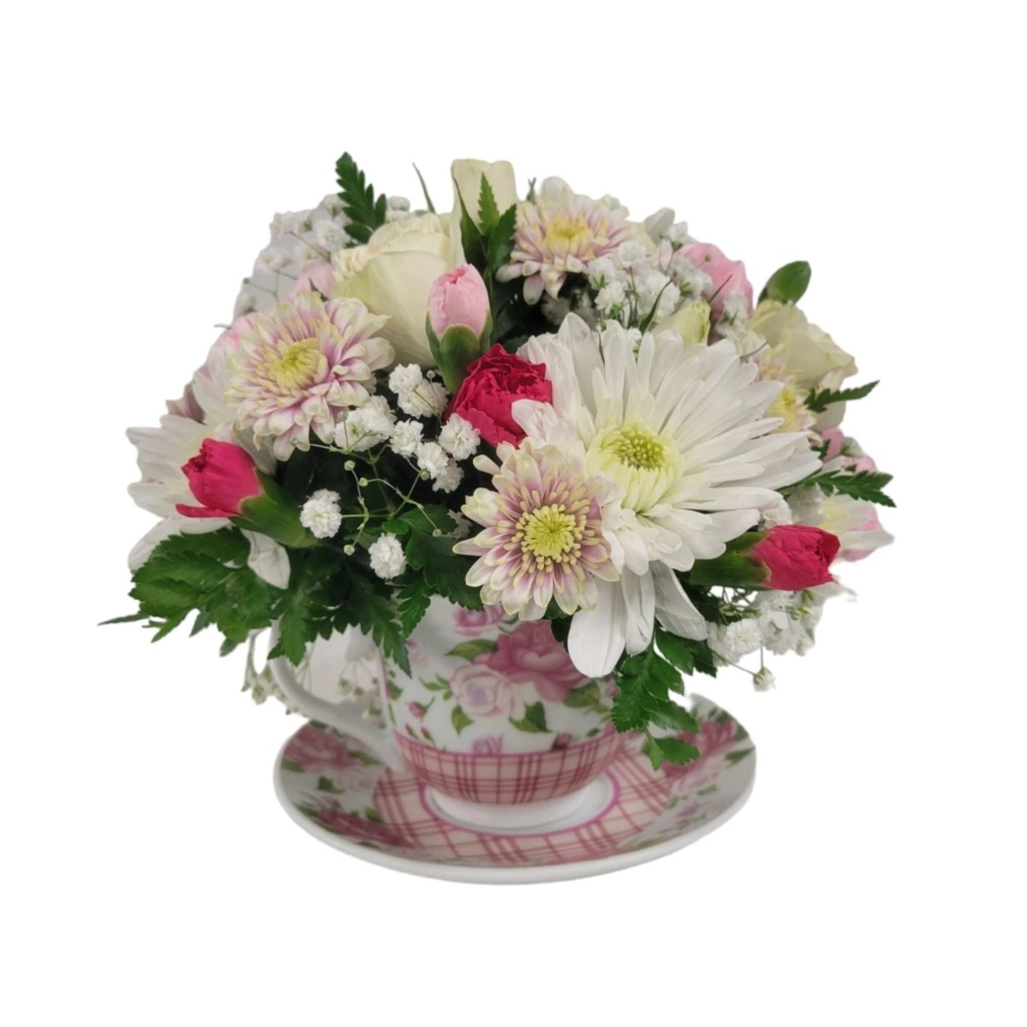 Cute tea cup filled with flowers such as baby roses, mums, minicarnations
