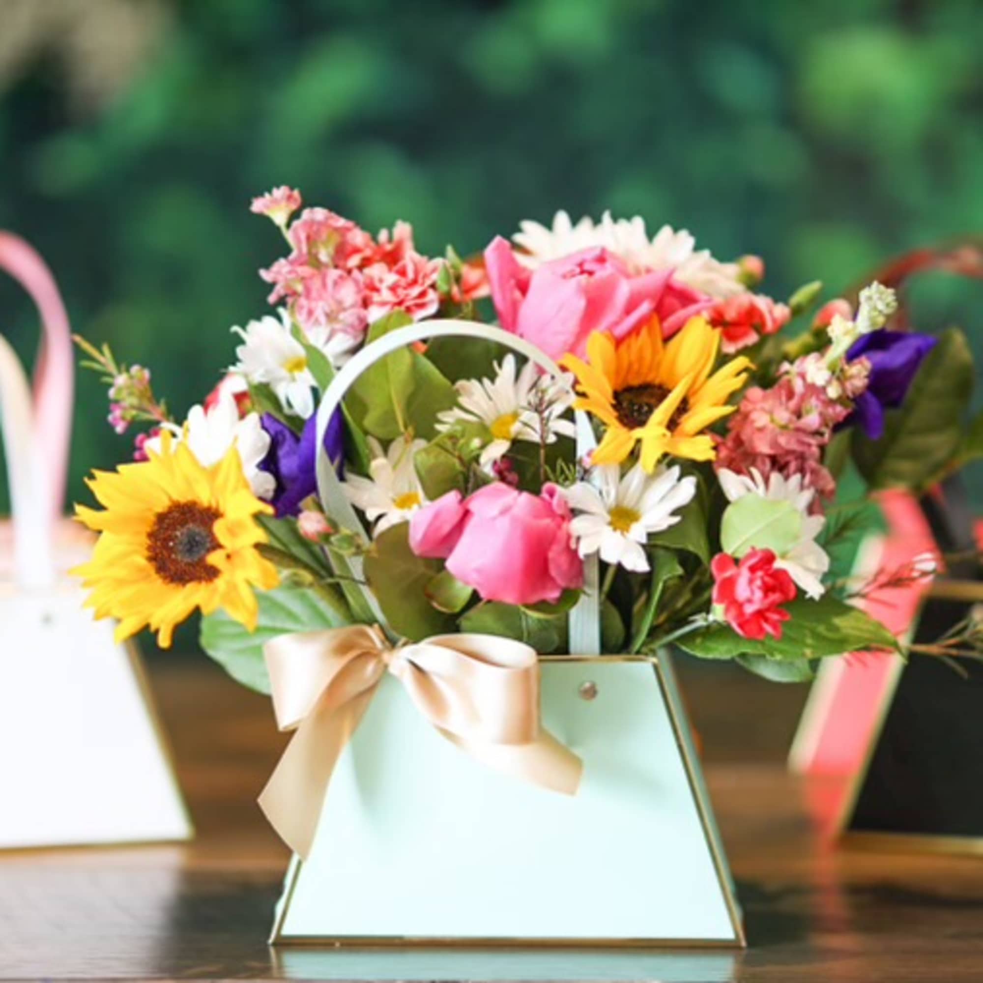 A spring arrangement in a colorful waterproof bag. The standard bag arrangements