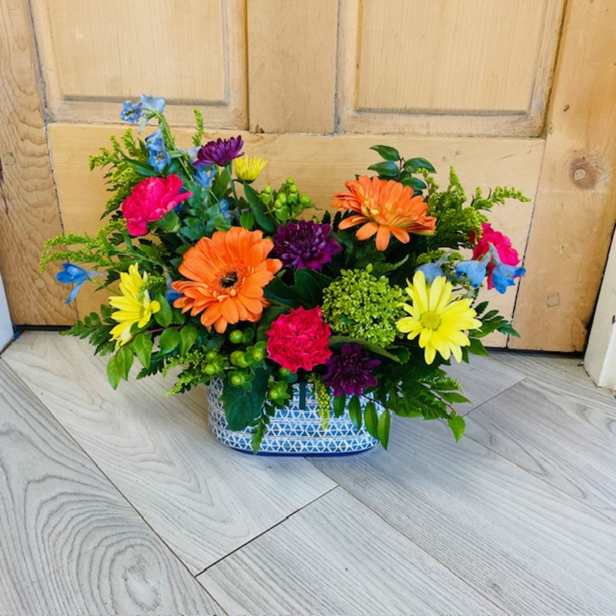A selection of bright and cheerful flowers arranged in a vase or
