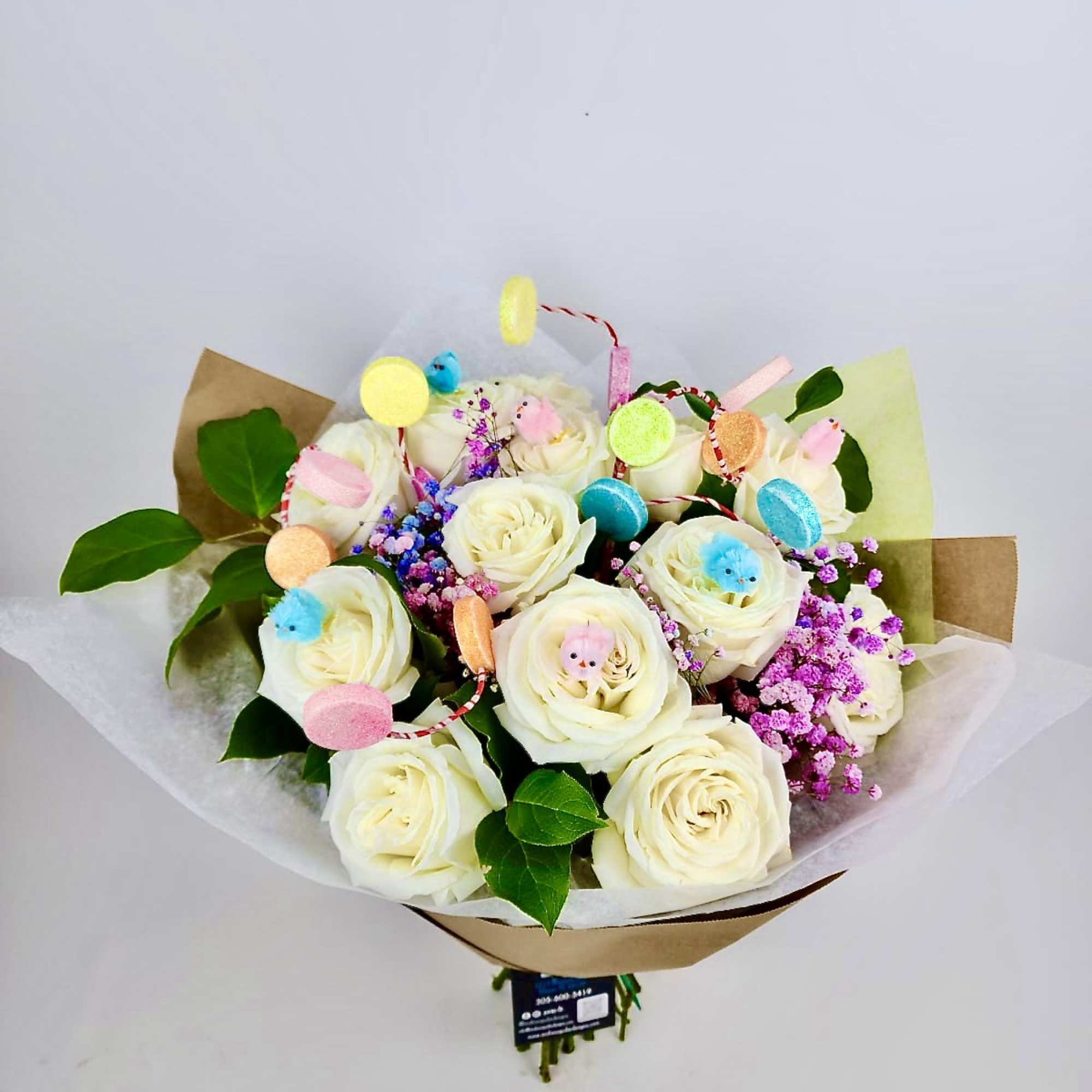 A bouquet of 12, 18, or 24 Premium White Roses with mixed A bouquet of 12, 18, or 24 Premium White Roses with mixed