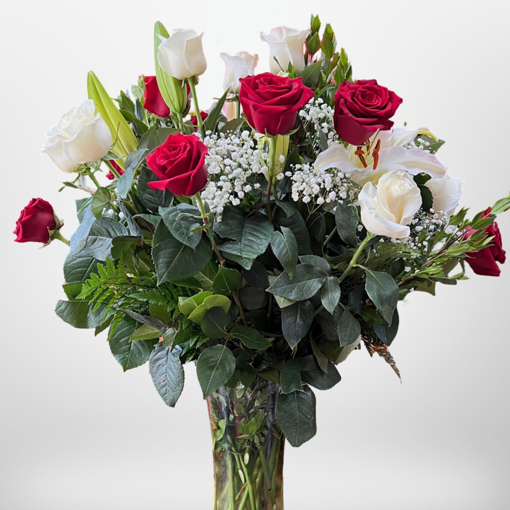 Two dozen amazing Ecuadorian roses with lilies, grand appearance, and amazing gift