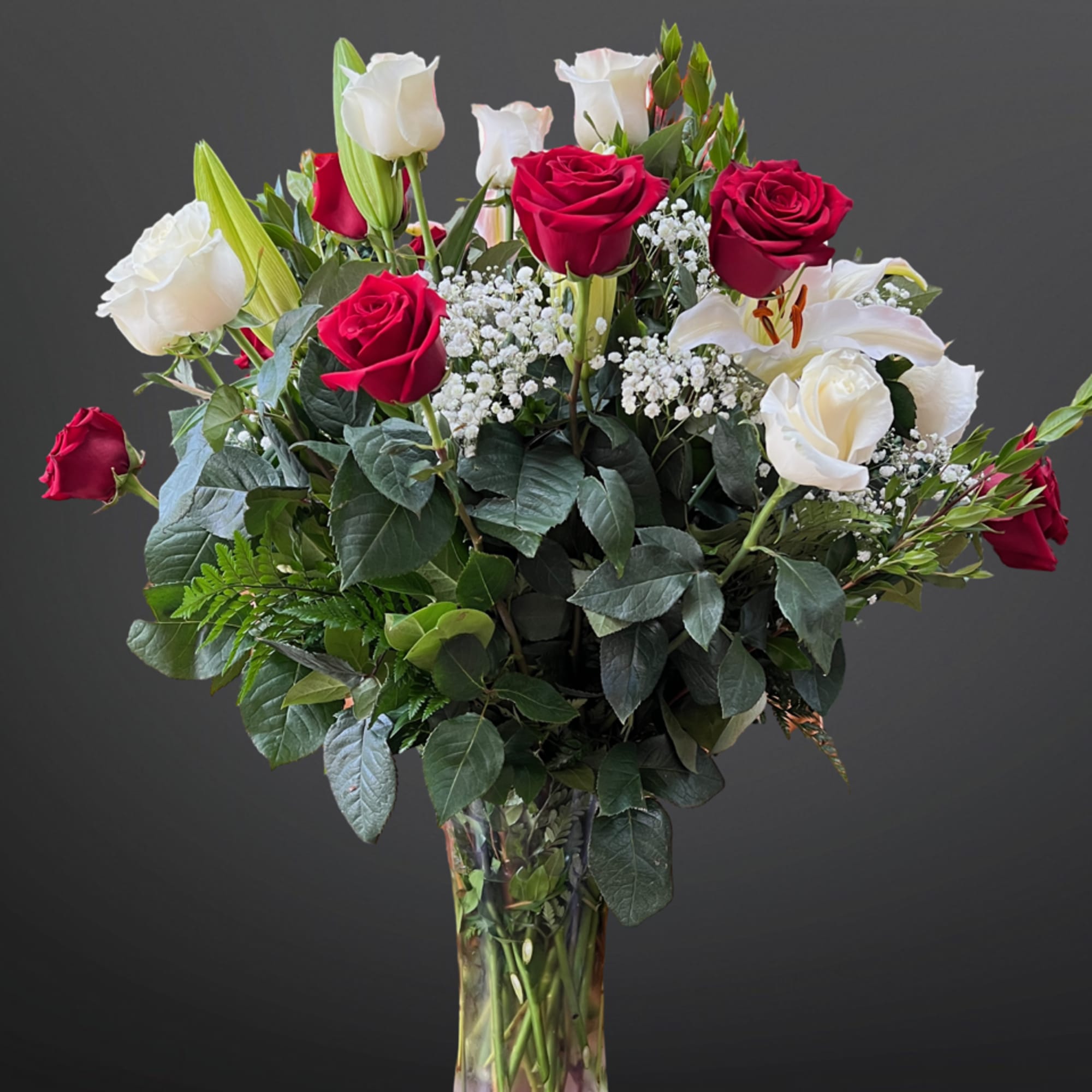 Two dozen amazing Ecuadorian roses with lilies, grand appearance, and amazing gift