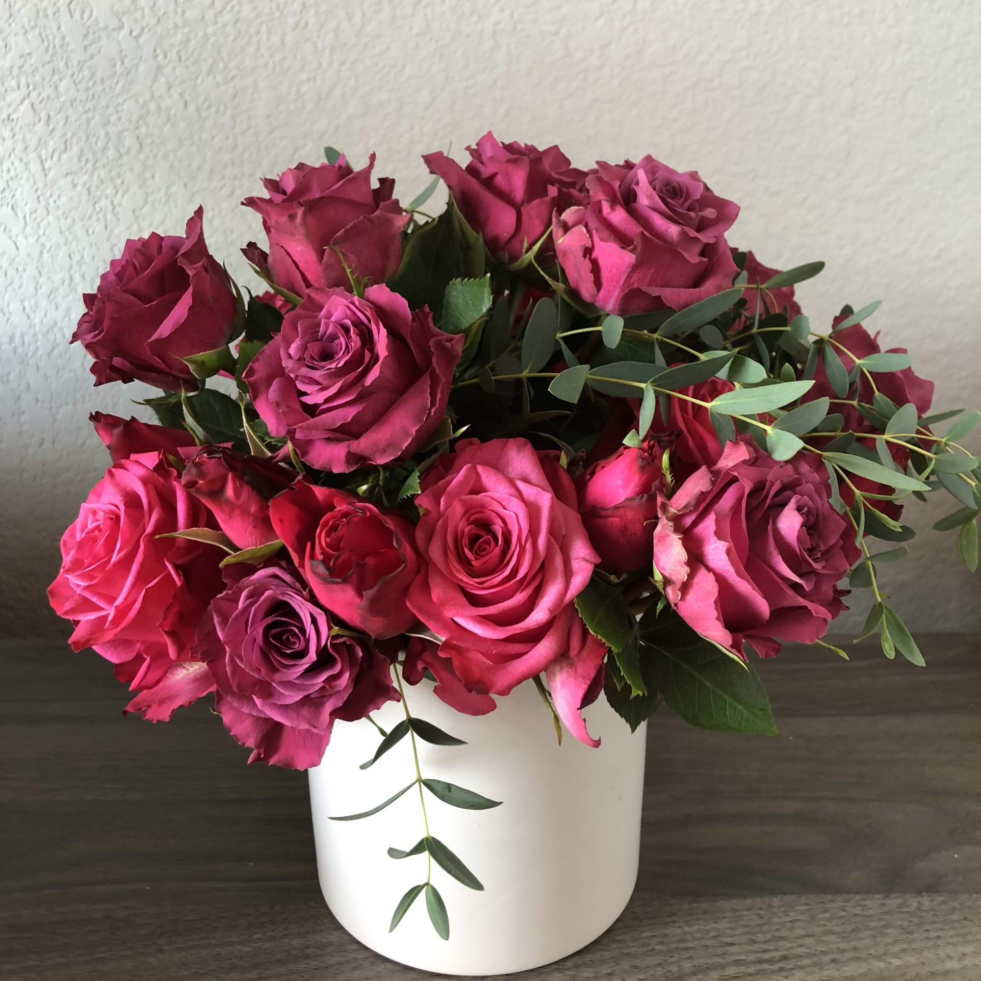 All pink roses with eucalyptus. Short design. 