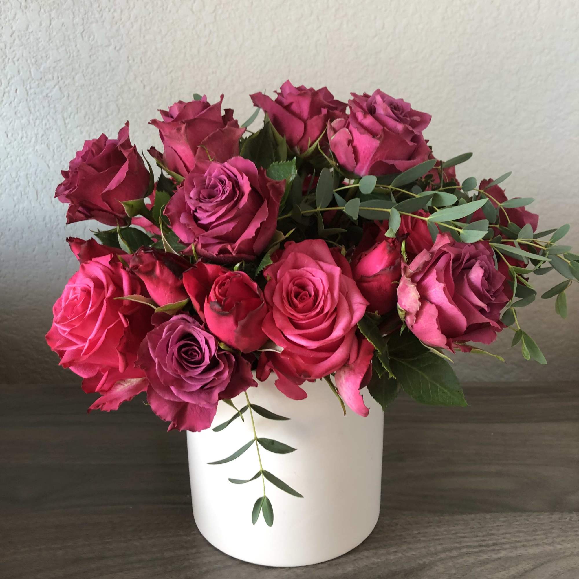 All pink roses with eucalyptus. Short design. 
