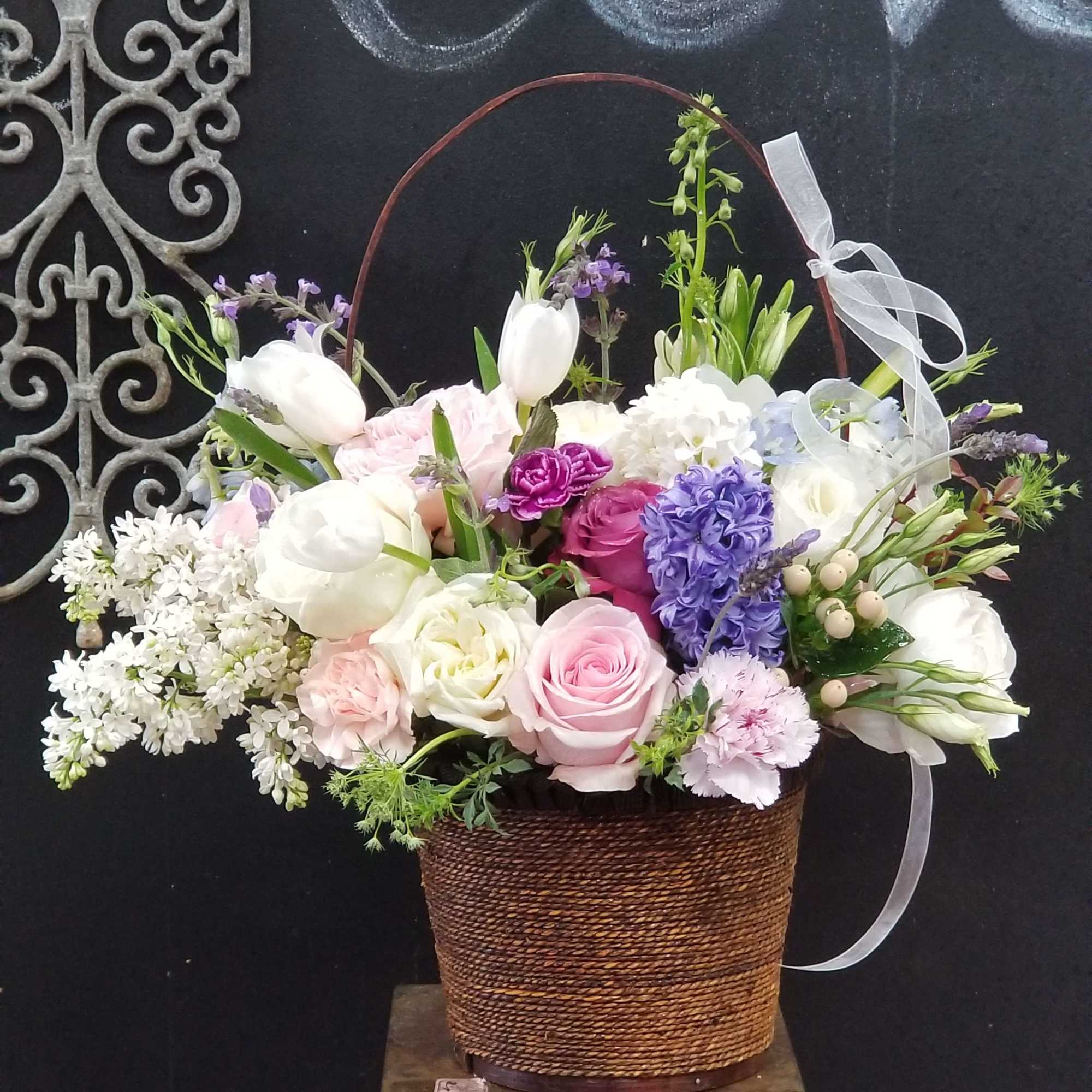 Stunning mixture of beautiful flowers in a basket for your favorite stylized
