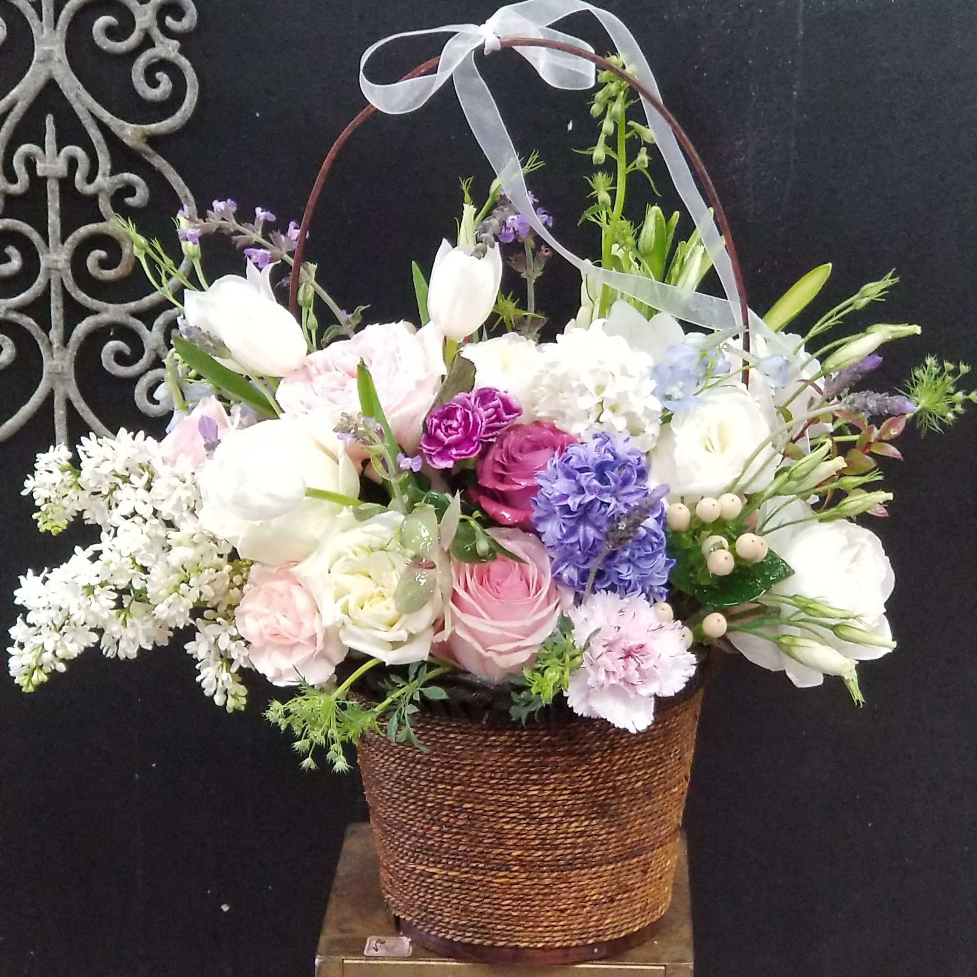 Stunning mixture of beautiful flowers in a basket for your favorite stylized