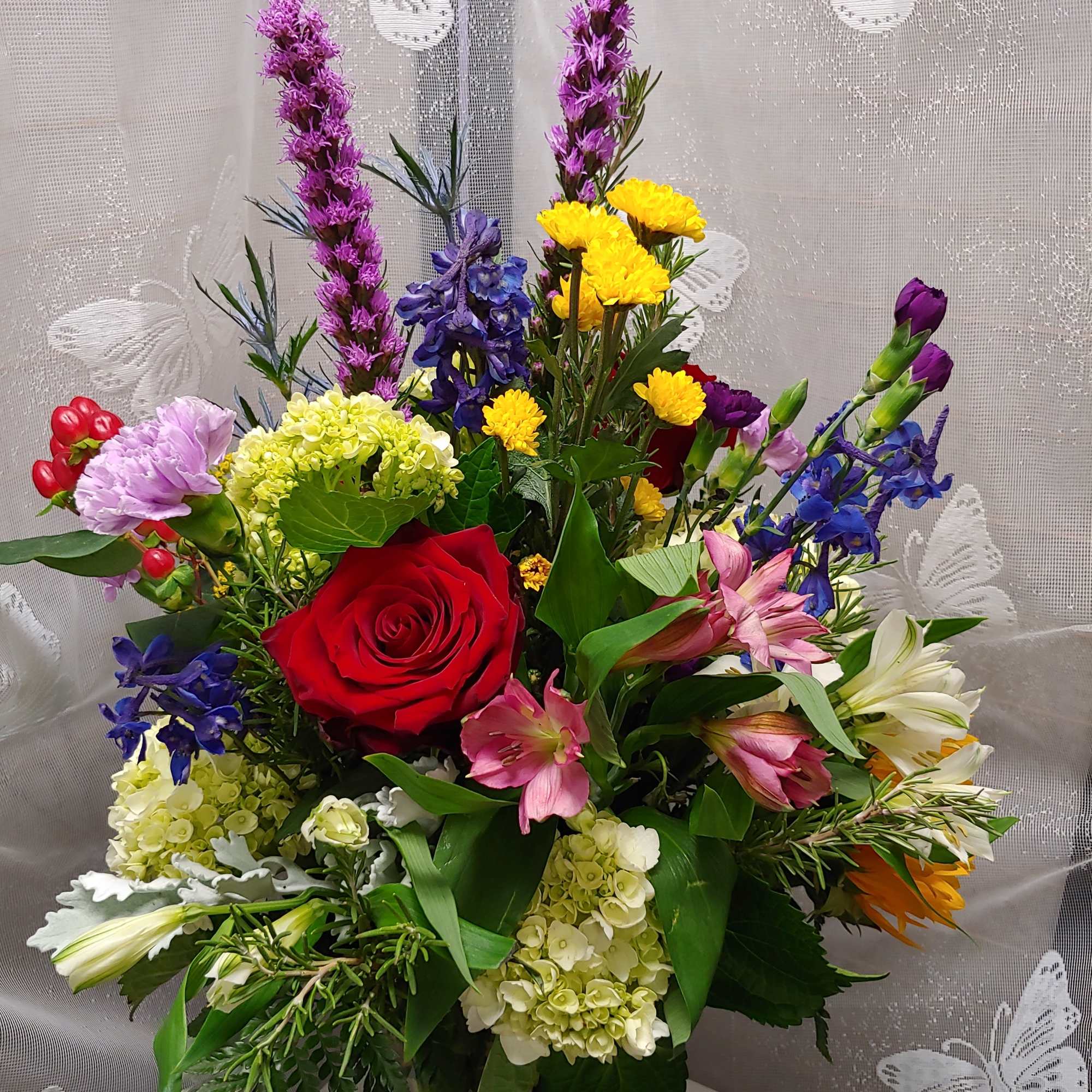 Mixed arrangement of hydrangea roses, liatris ,Daisy&#039;s, Alstroemeria carnations, and delphinium it&#039;s